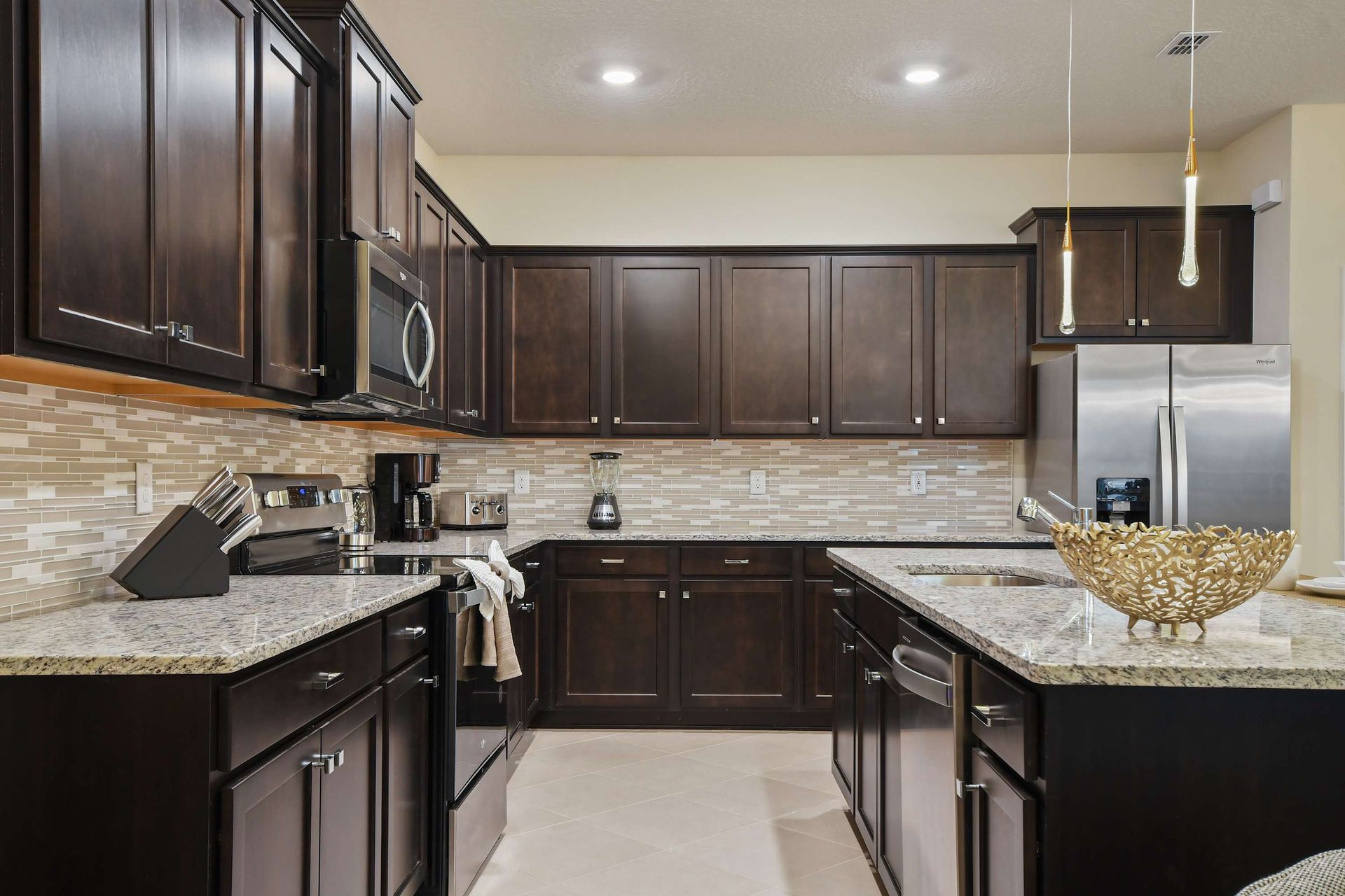 Fully equipped modern kitchen with granite countertops and style.