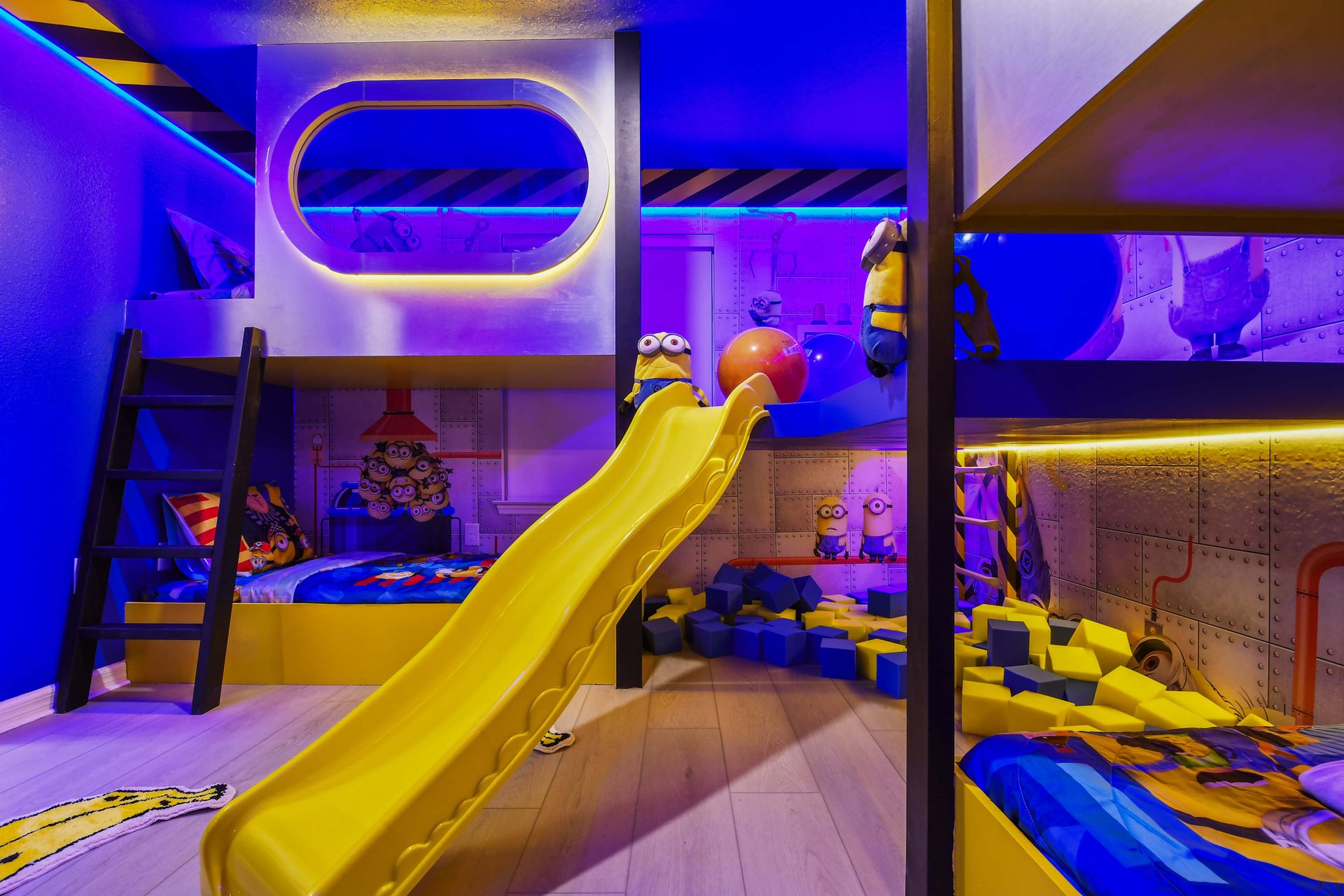 Whimsical Minion paradise with slide, cozy bunks, and playful vibes!