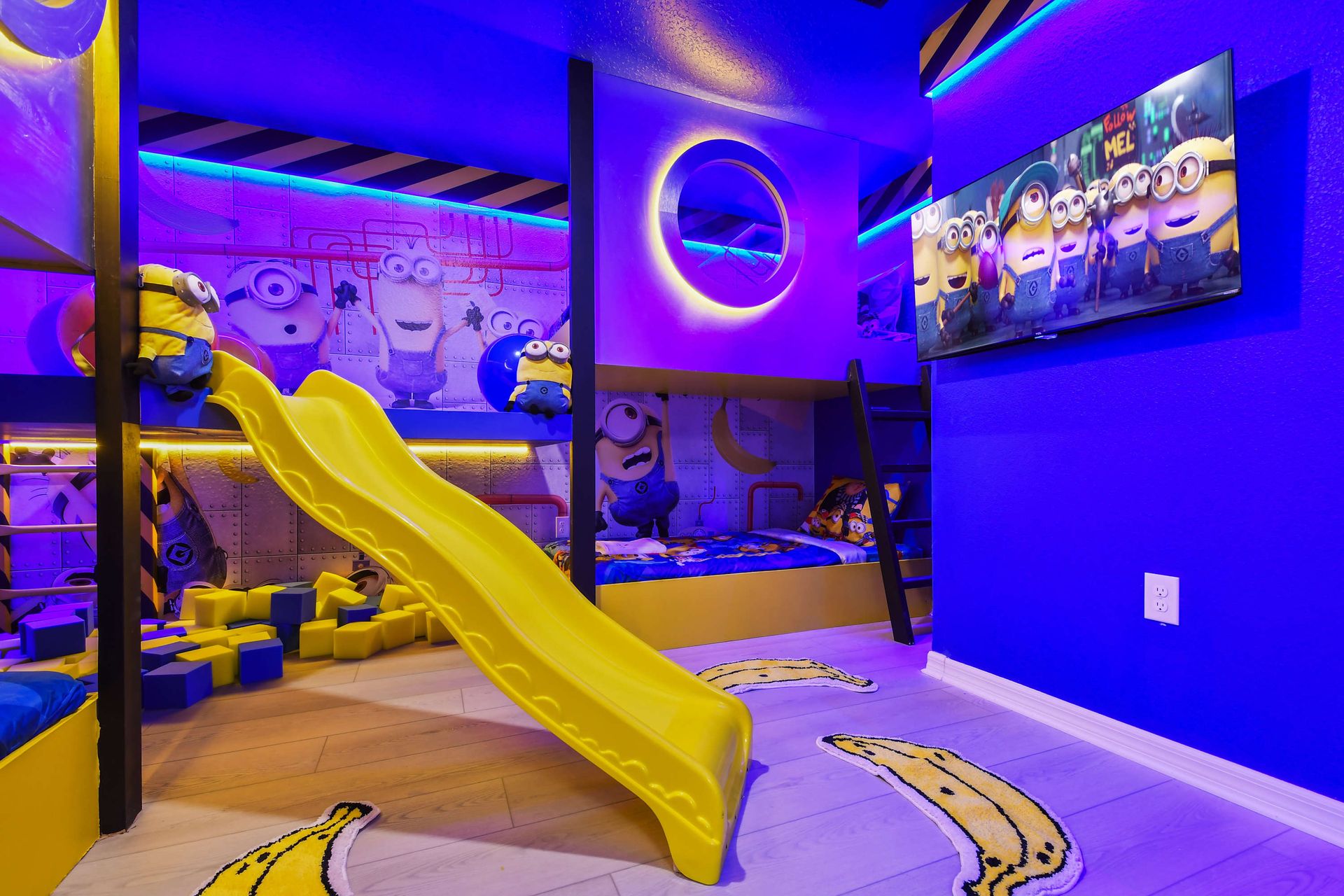 Minion-themed kids' room with slide, vibrant colors, and fun decor!