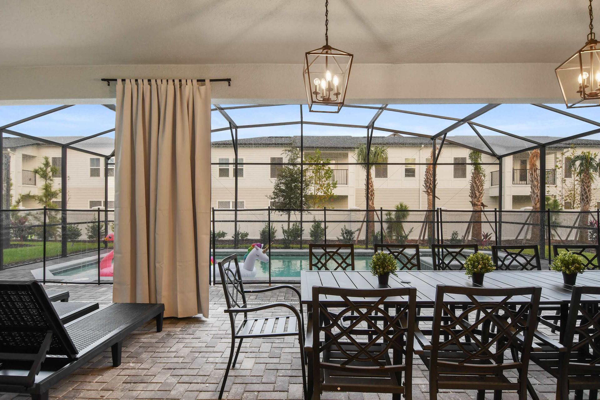 Dine al fresco on the patio by the pool—perfect for family meals!