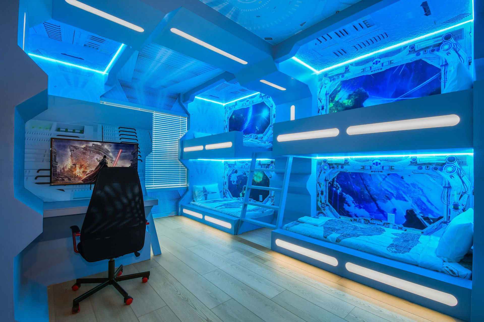 Immersive space-themed room with glowing bunk beds and gaming area.