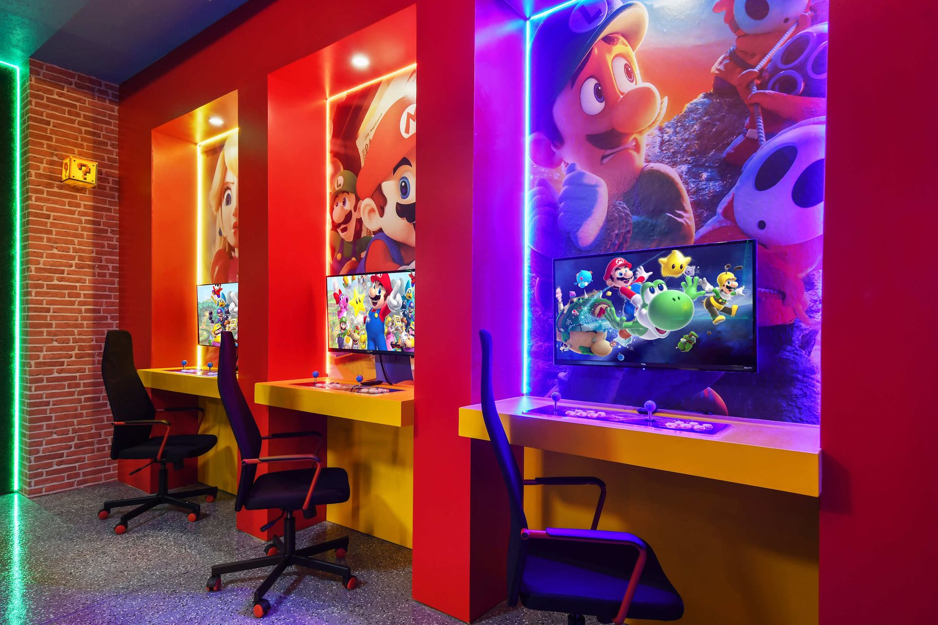 Gaming stations in a vibrant Super Mario-themed playroom!