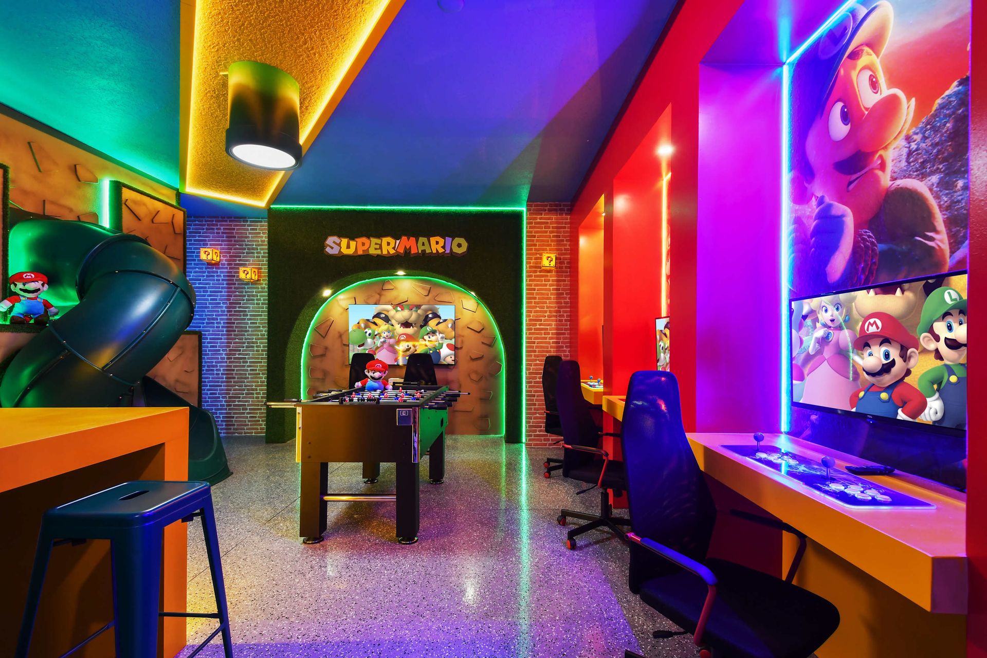 Epic Super Mario-themed game room with arcade, foosball, and slides!
