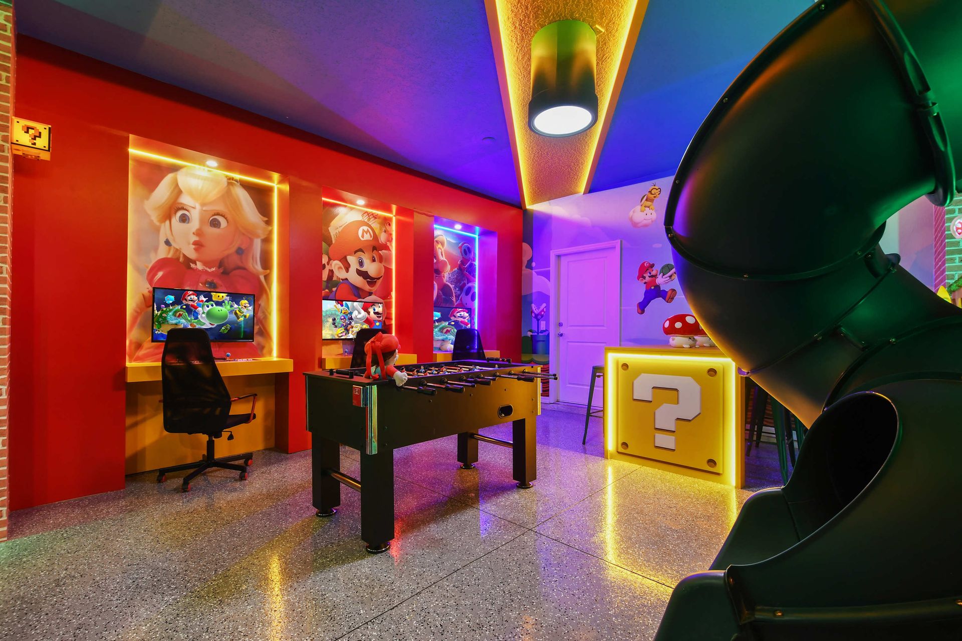 Colorful Super Mario game room with arcade stations and slides!