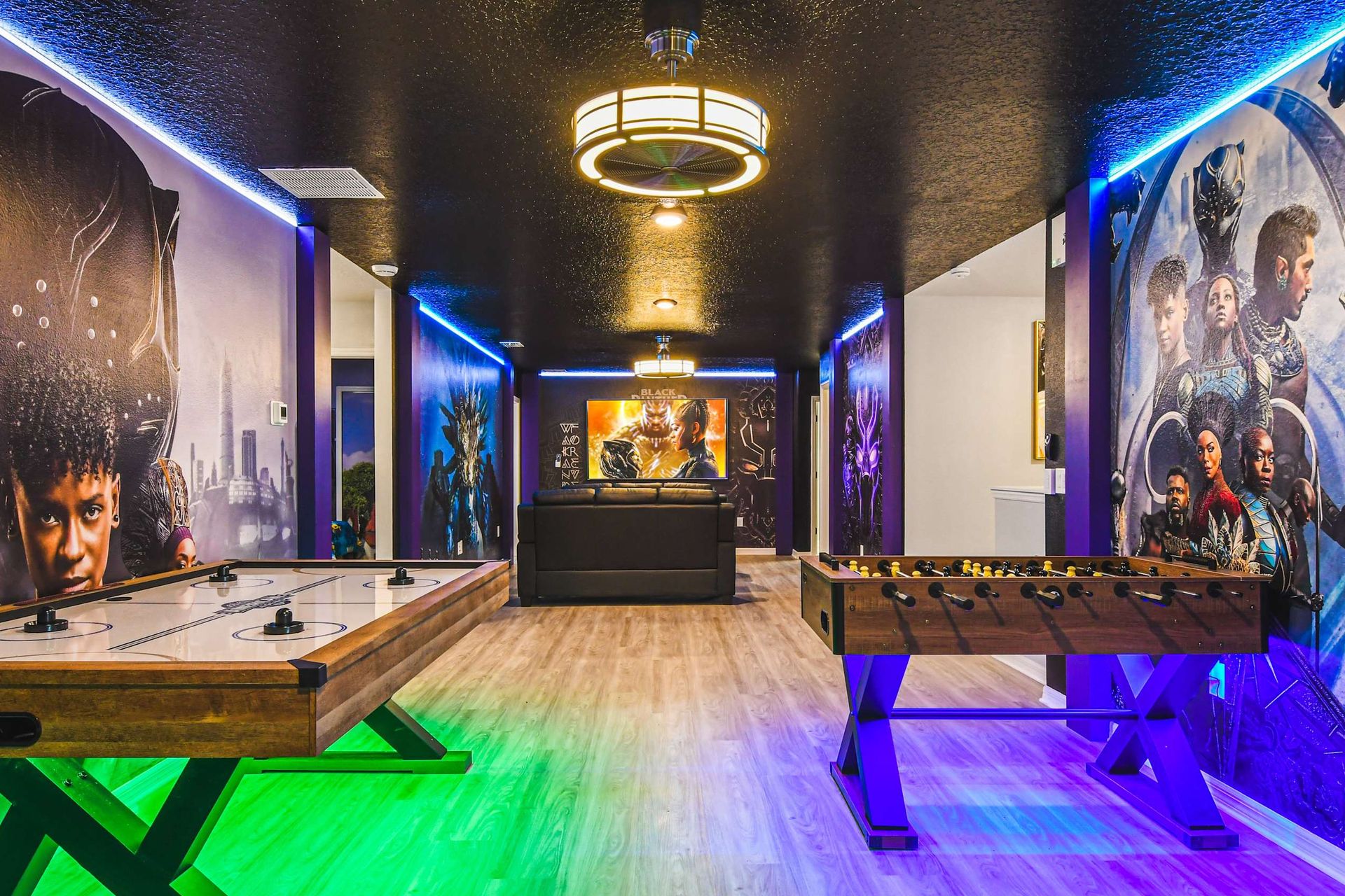 Action-packed loft with air hockey, foosball, movie lounge, and superhero murals.