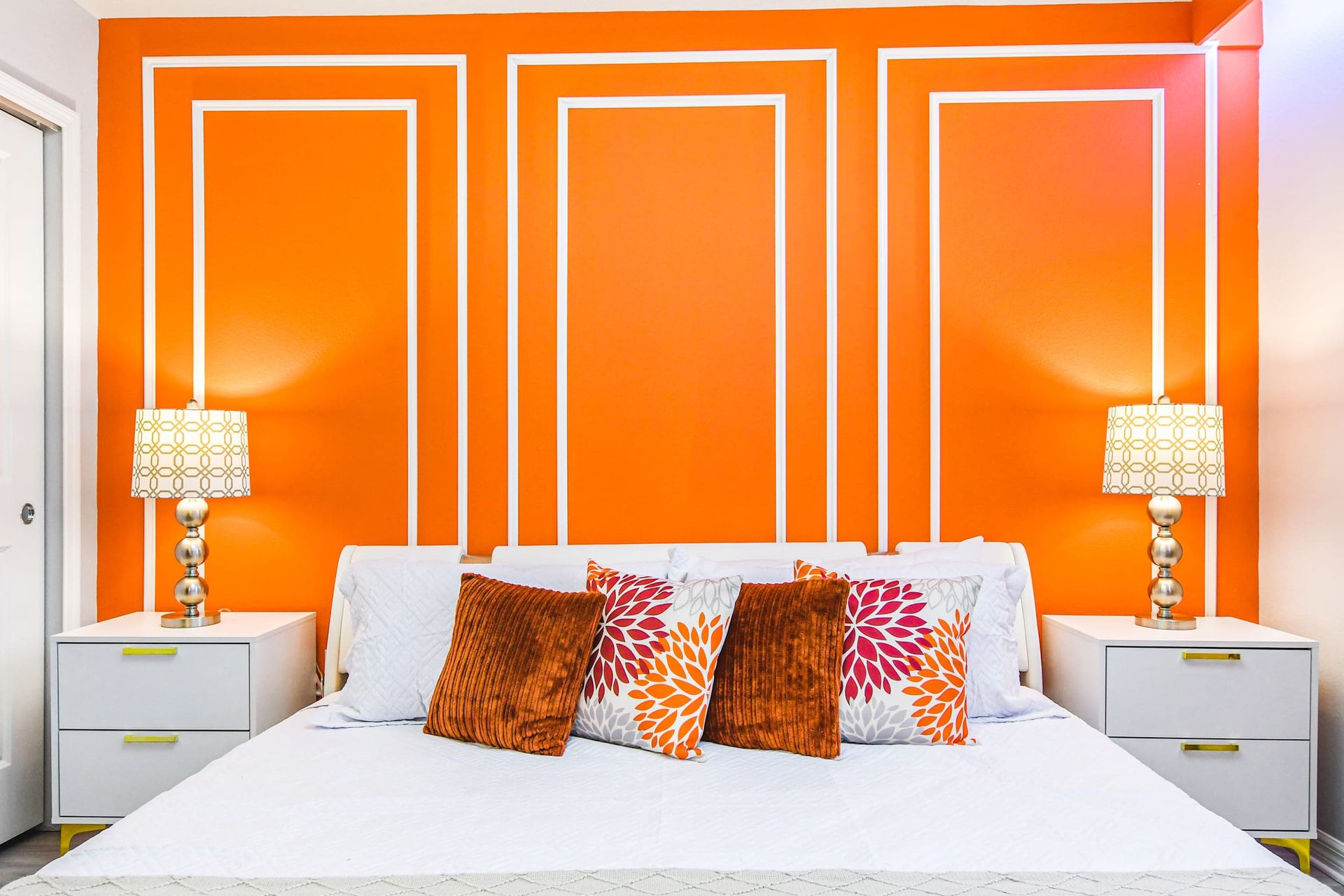 Vibrant orange suite with bold style, plush bedding, and a chic modern vibe.