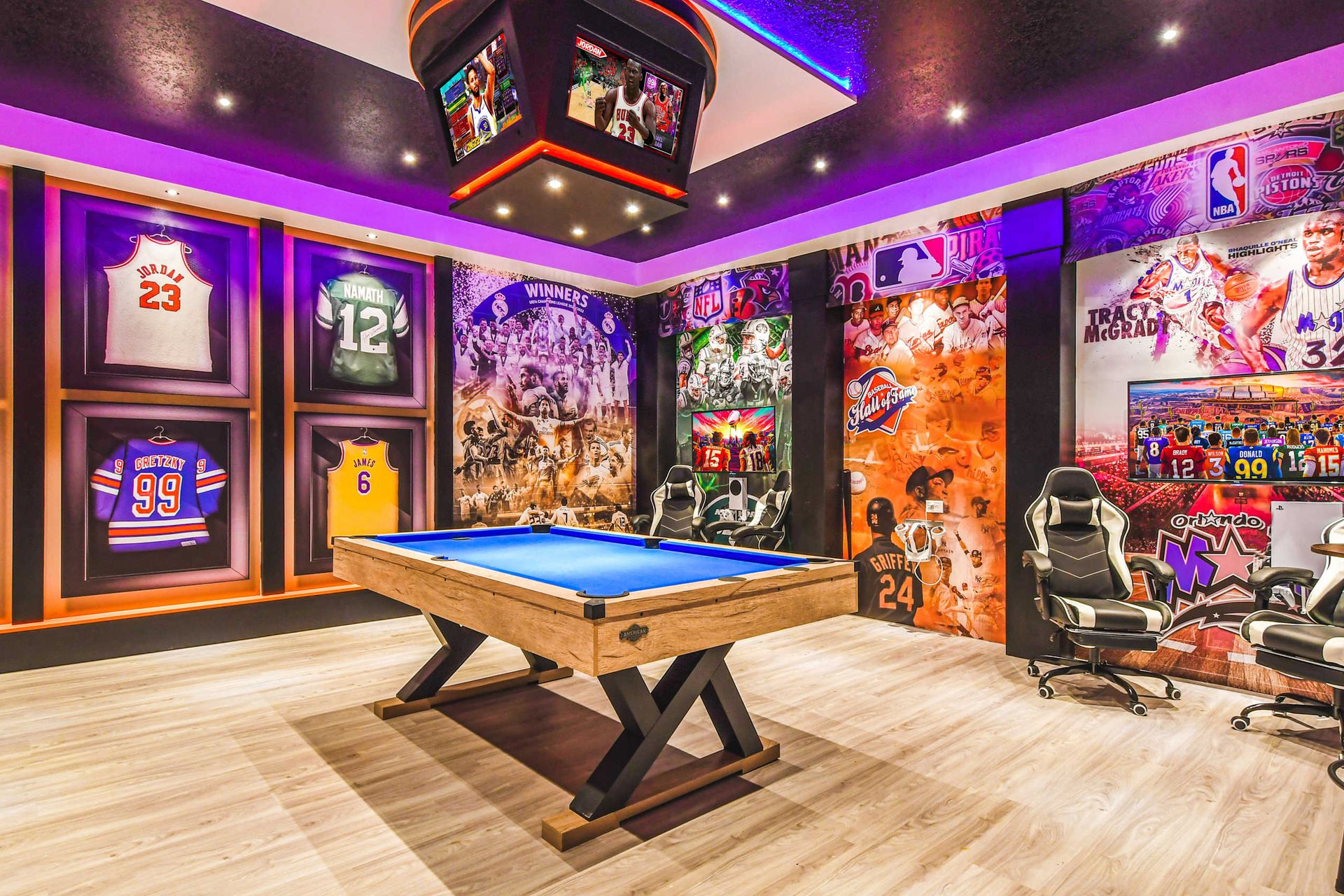 Legendary sports lounge with framed jerseys, pool table, gaming chairs, and murals.
