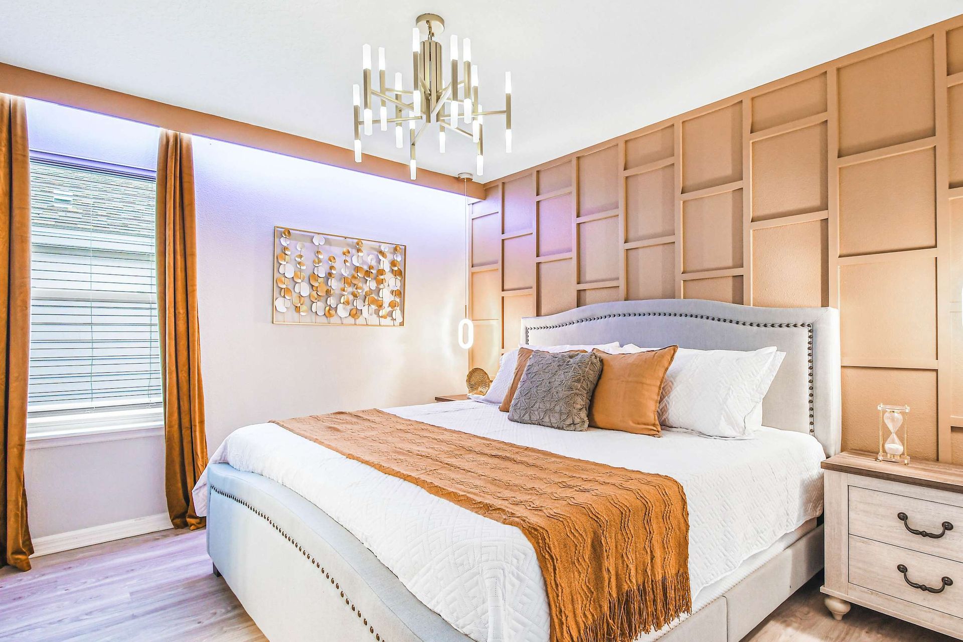 Chic gold tones and cozy textures create a warm, luxurious bedroom retreat.