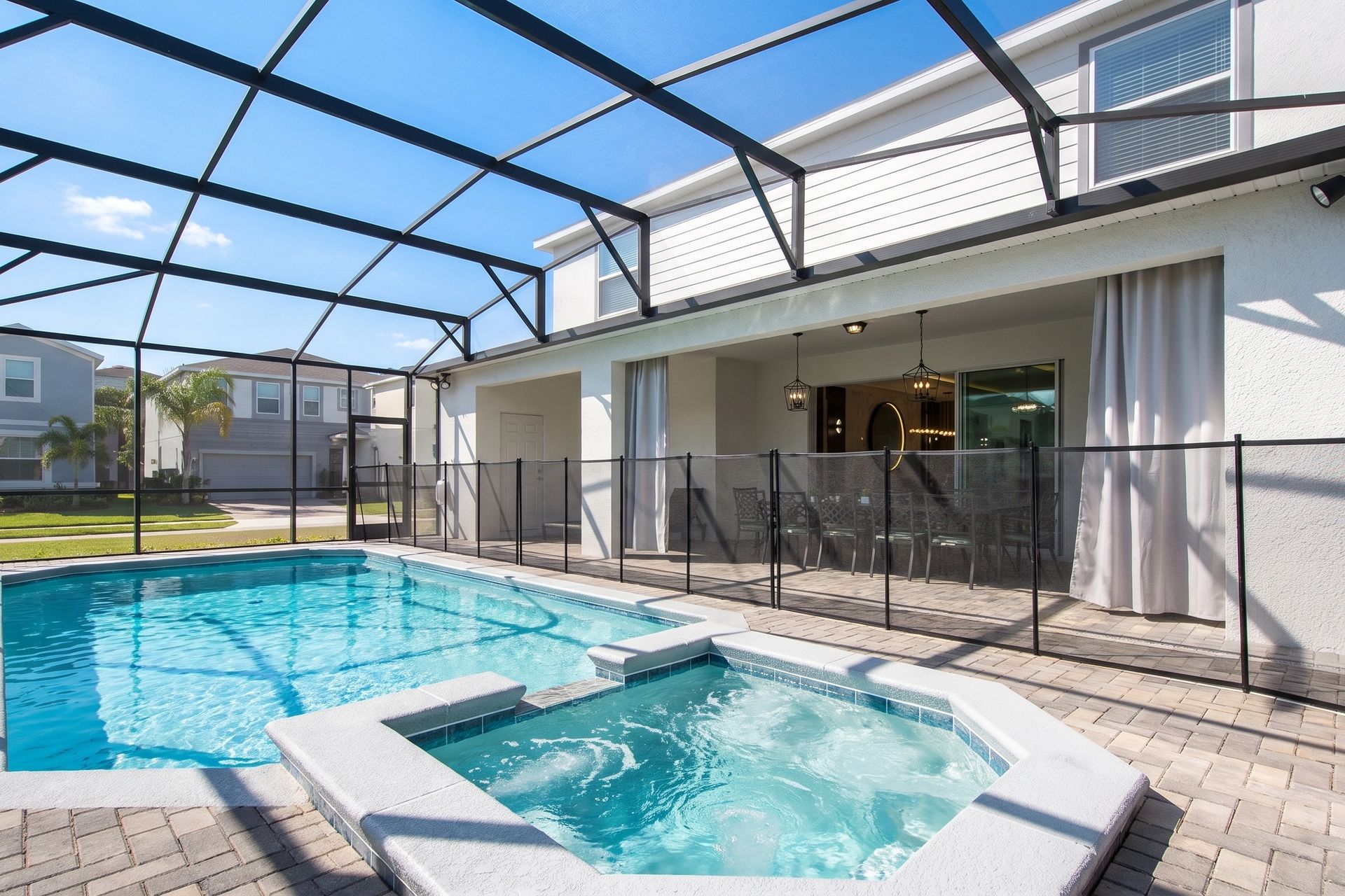 Relax in the private screened pool and spa, perfect for evenings under the lights.