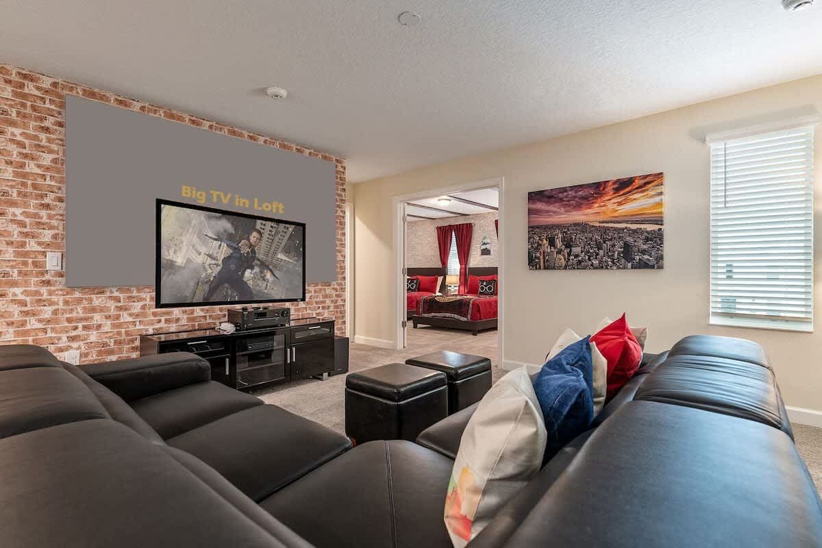 Loft lounge with big TV, comfy sectional, and direct access to themed rooms!