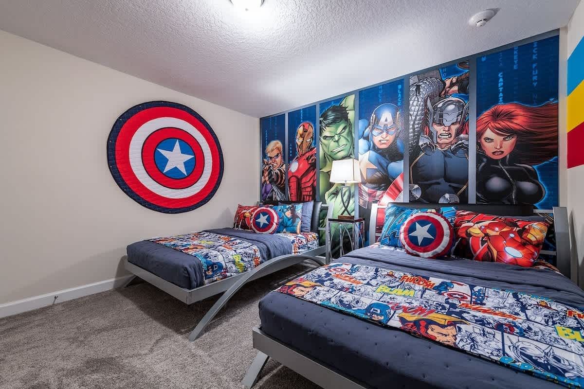 Hero-themed bedroom with bold murals, twin beds, and action-packed decor!
