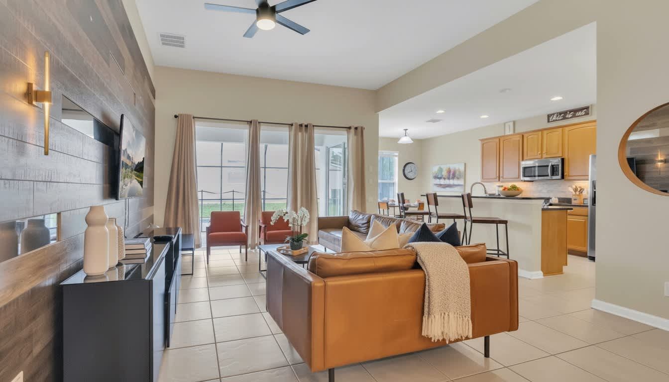 现代优雅的开放式起居室，温暖的皮革质感与精致的木纹背景墙完美融合。