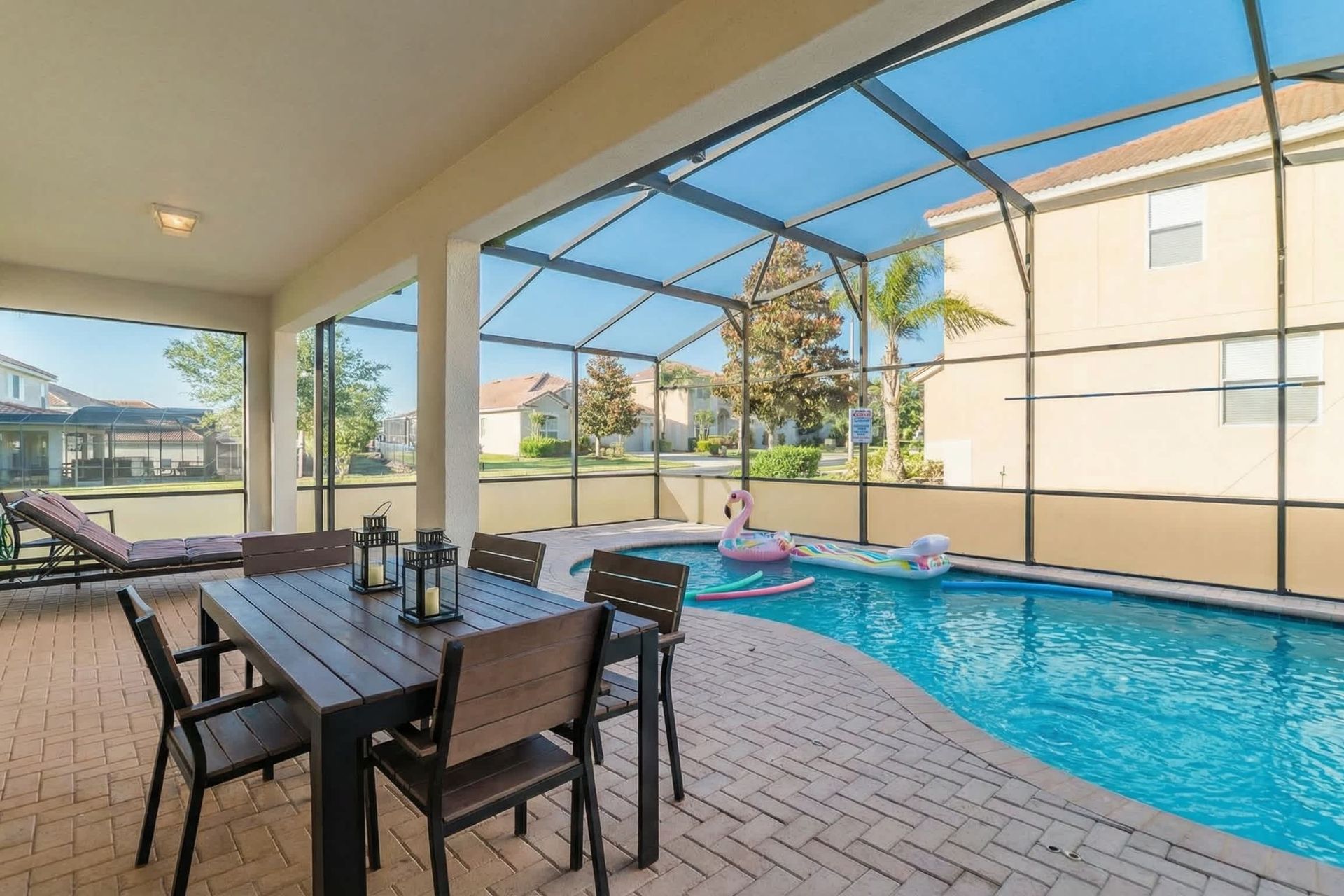 Bask in the golden hour glow of this screened poolside sanctuary, designed for ultimate relaxation.