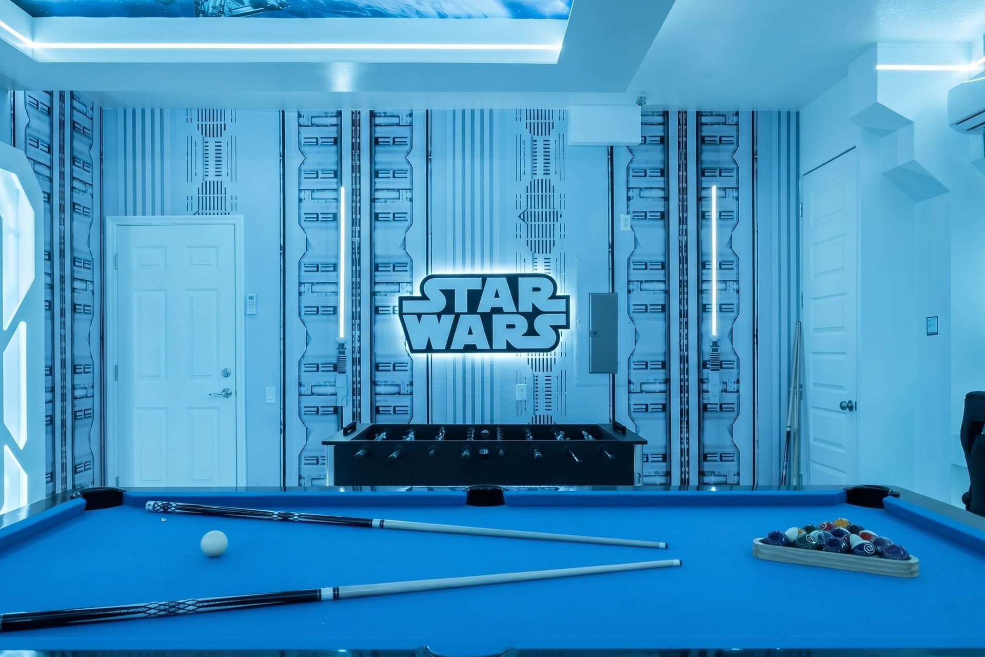 Pool, foosball, and an epic STAR WARS wall.