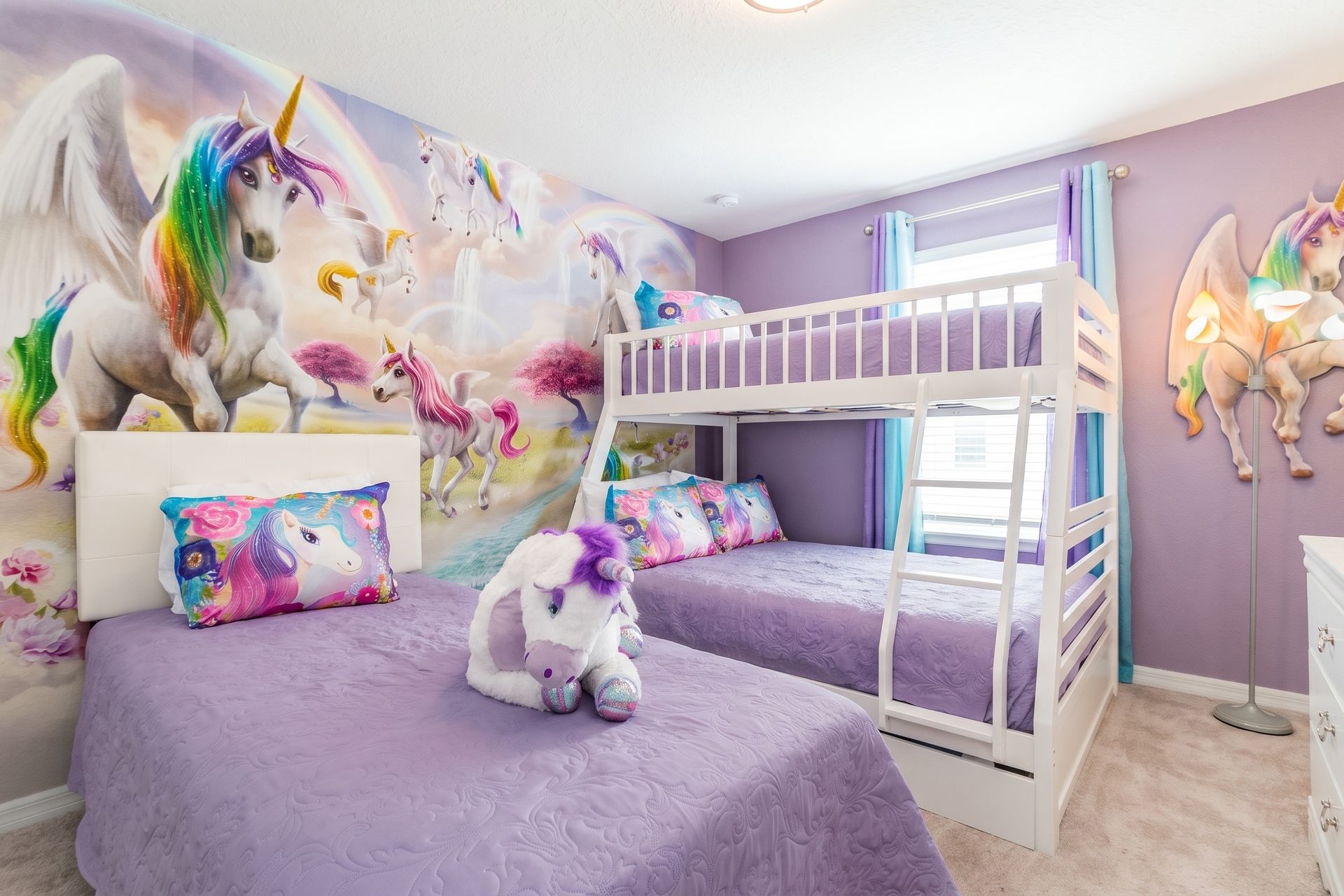 Immerse in enchantment with a unicorn-inspired room, featuring a bunk bed and a twin bed for a magical and cozy stay.