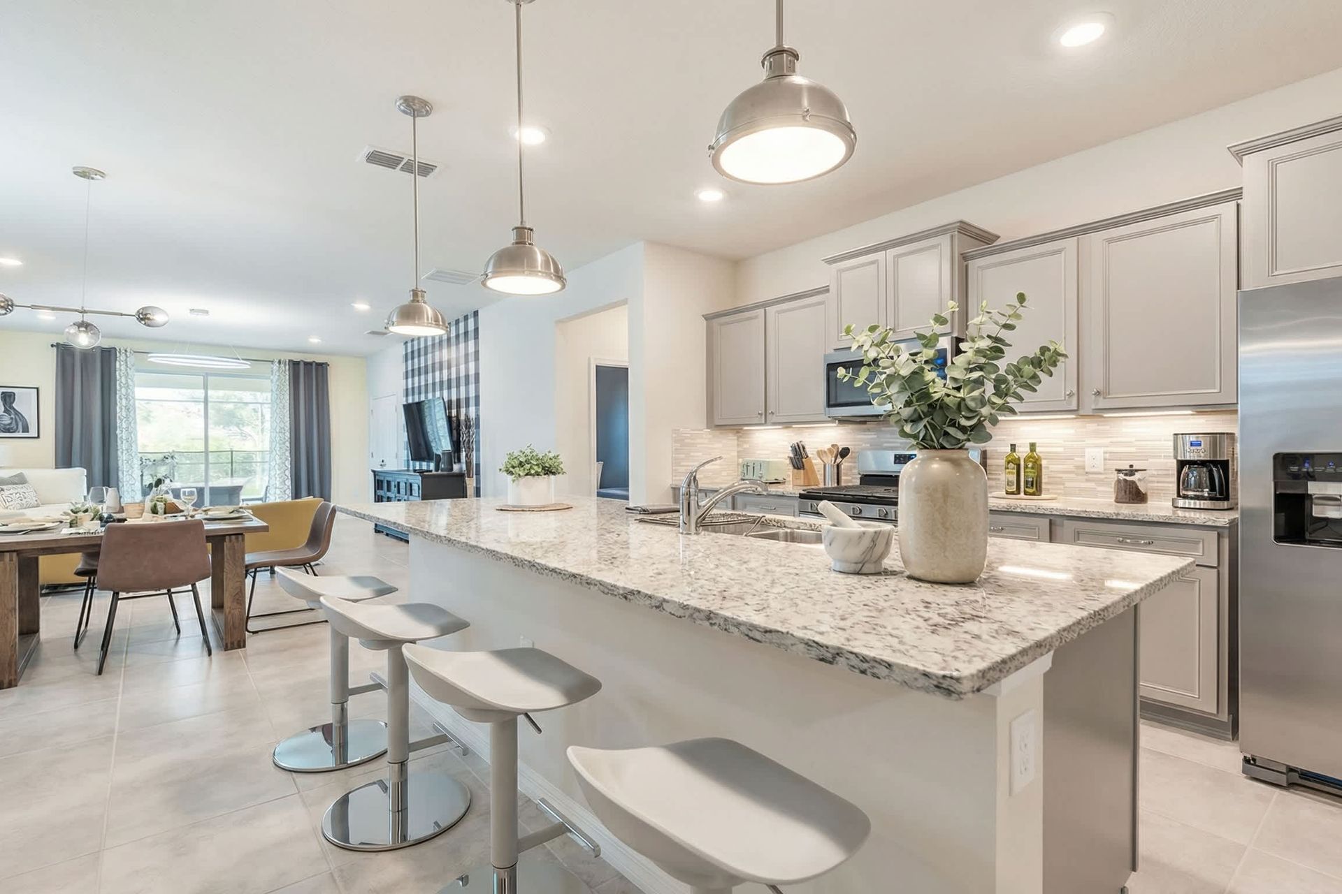 Modern kitchen seamlessly integrated with a sleek mini breakfast bar
