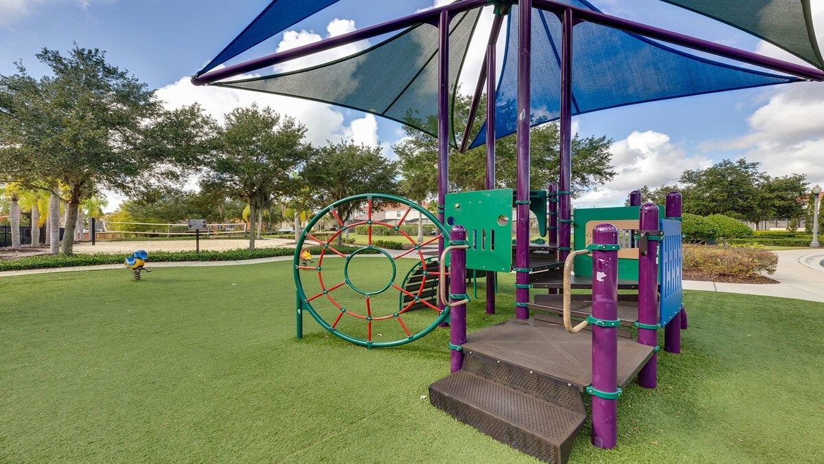 Family fun! Shaded playground & nearby volleyball court await!