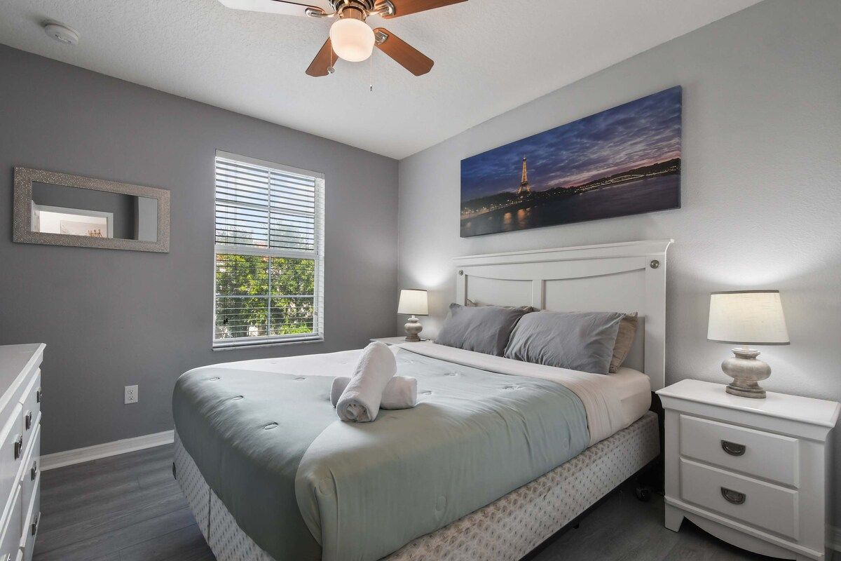 Tranquil bedroom with cozy decor, natural light, and plush bedding!
