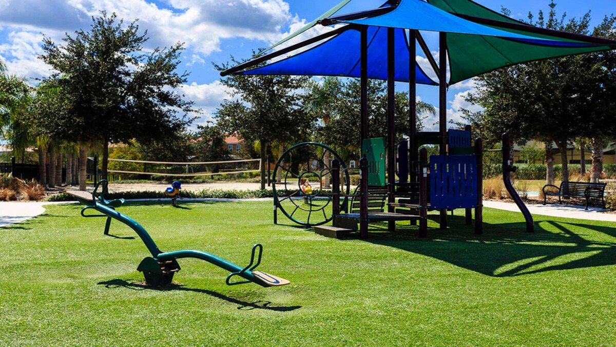 Family-friendly playground with shaded areas and a volleyball court!