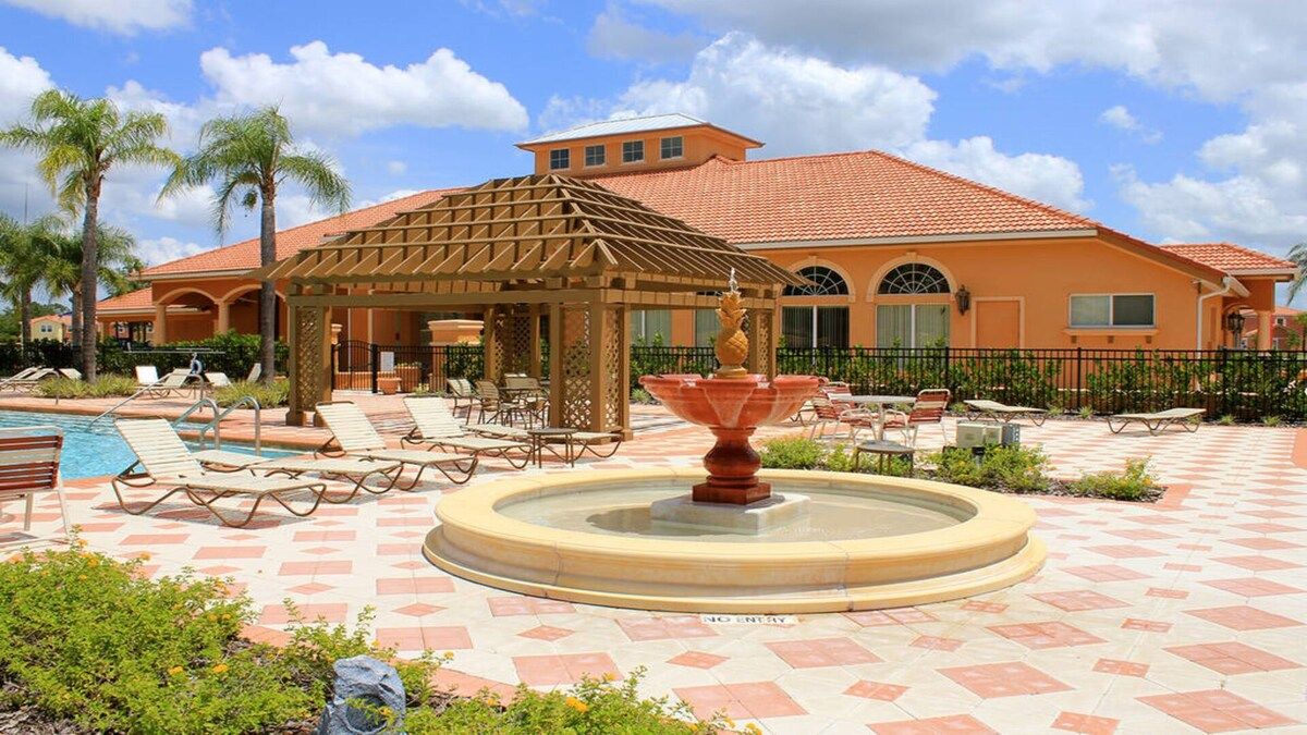 Resort-style retreat! Poolside lounging with a charming fountain.