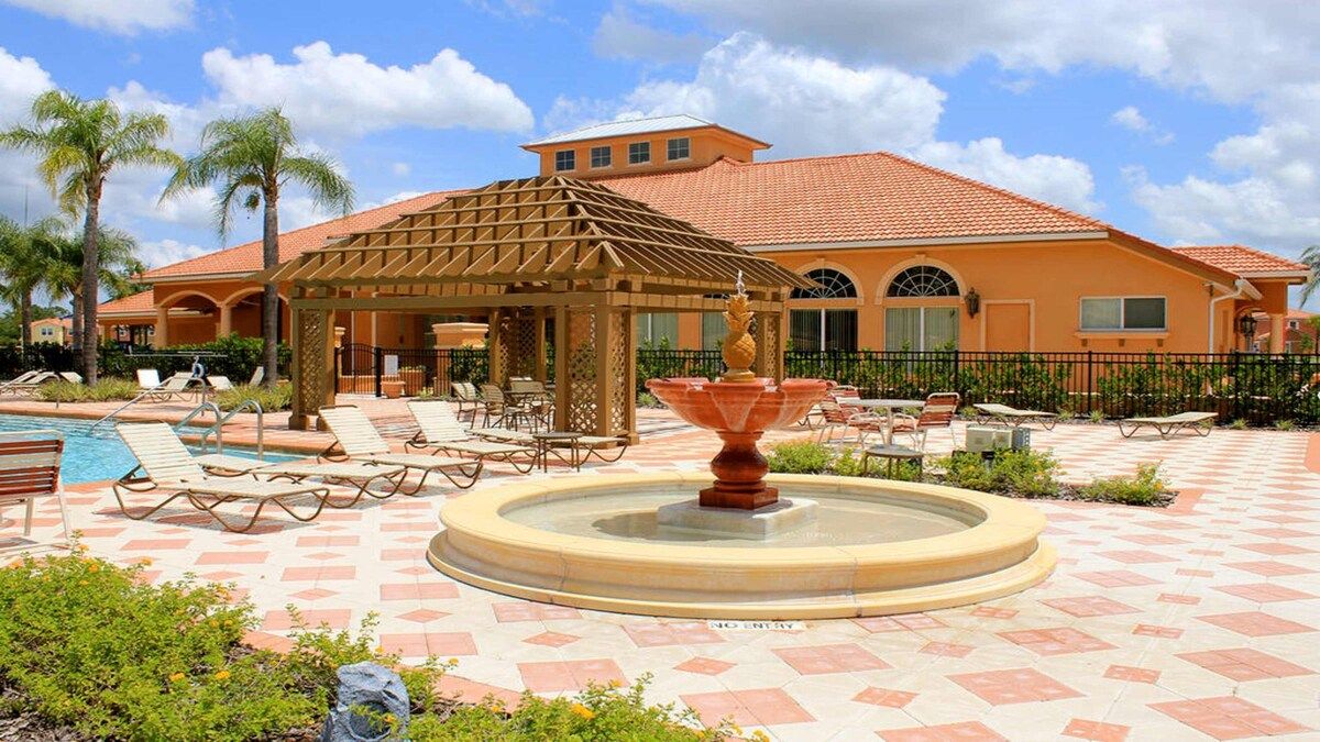 Resort-style retreat! Poolside lounging with a charming fountain.