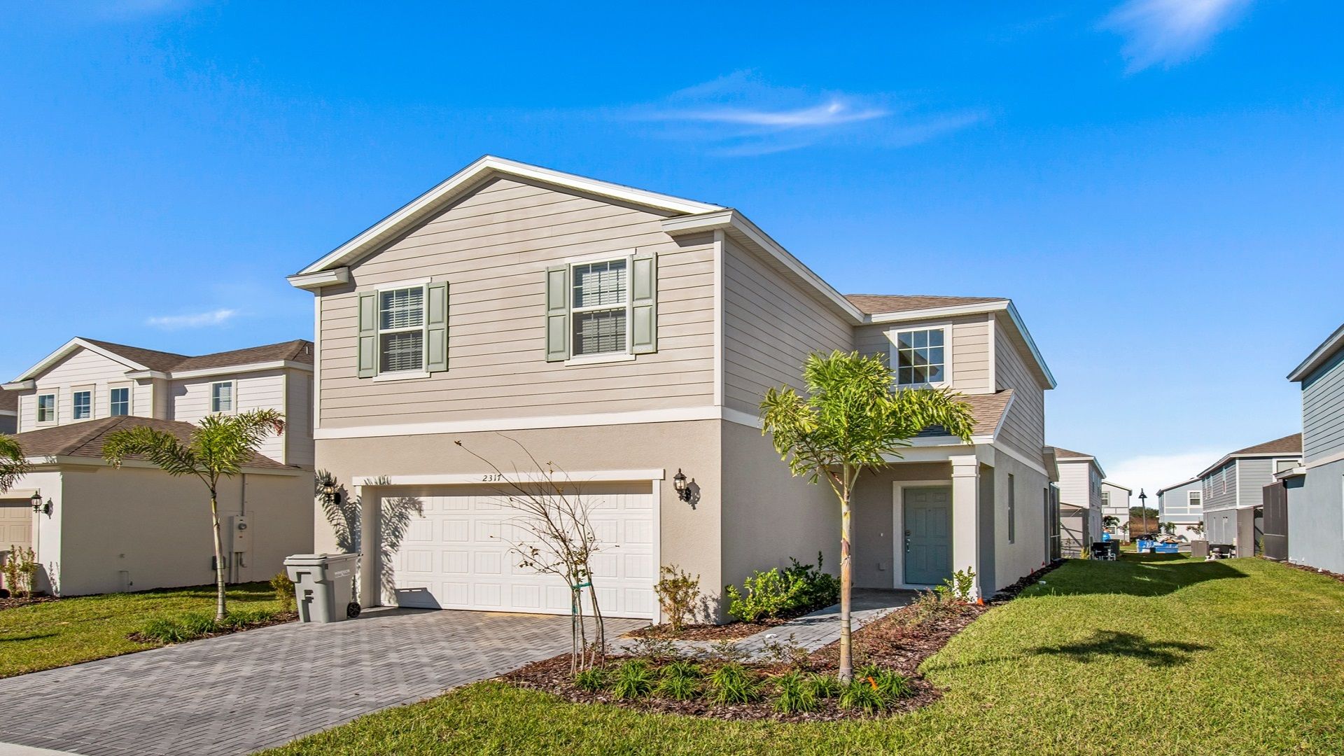 Home Exterior: Modern elegance meets lush greenery.