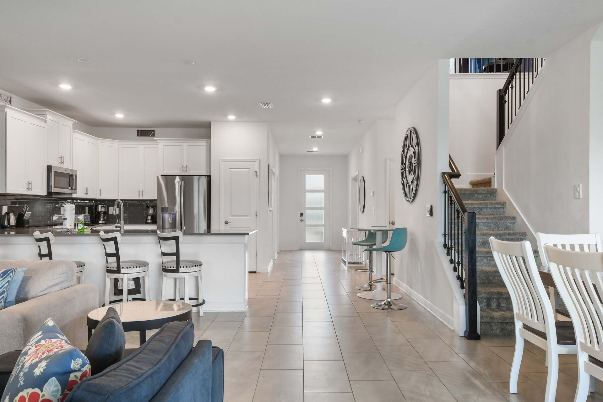 Spacious open-plan home with modern kitchen, dining area, and bright stylish decor