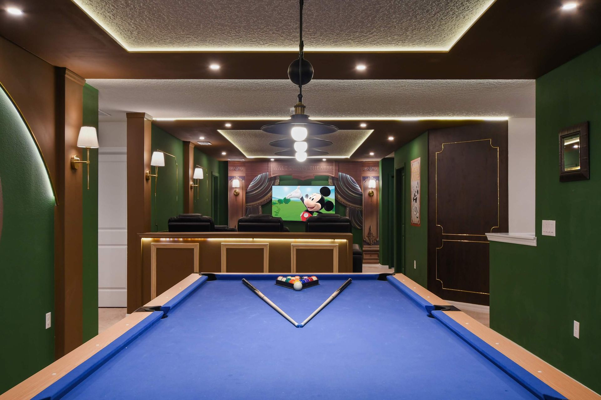 Entertainment room with Mickey Mouse decor, pool table, and theater!