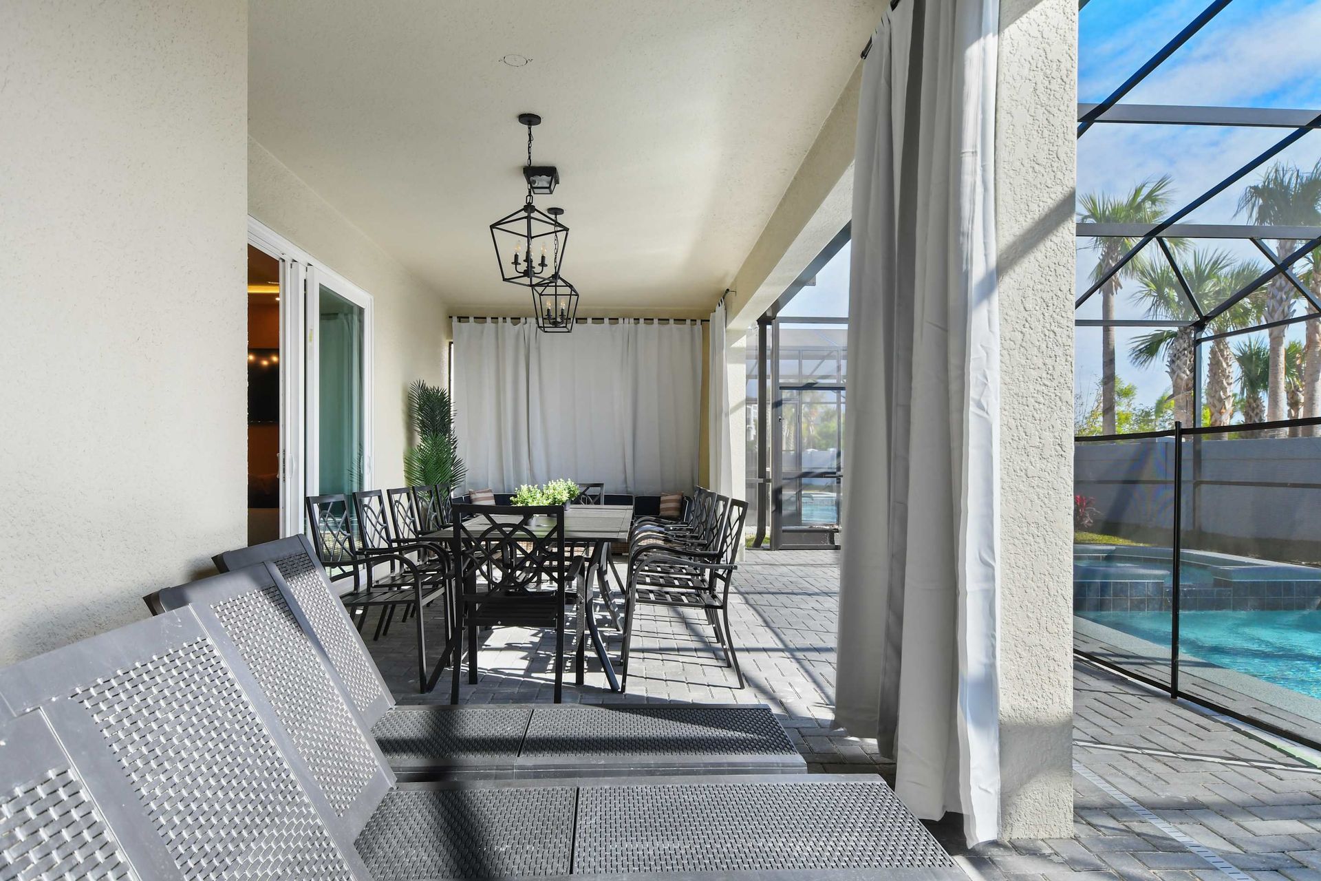 Spacious outdoor dining area with elegant seating and natural light!