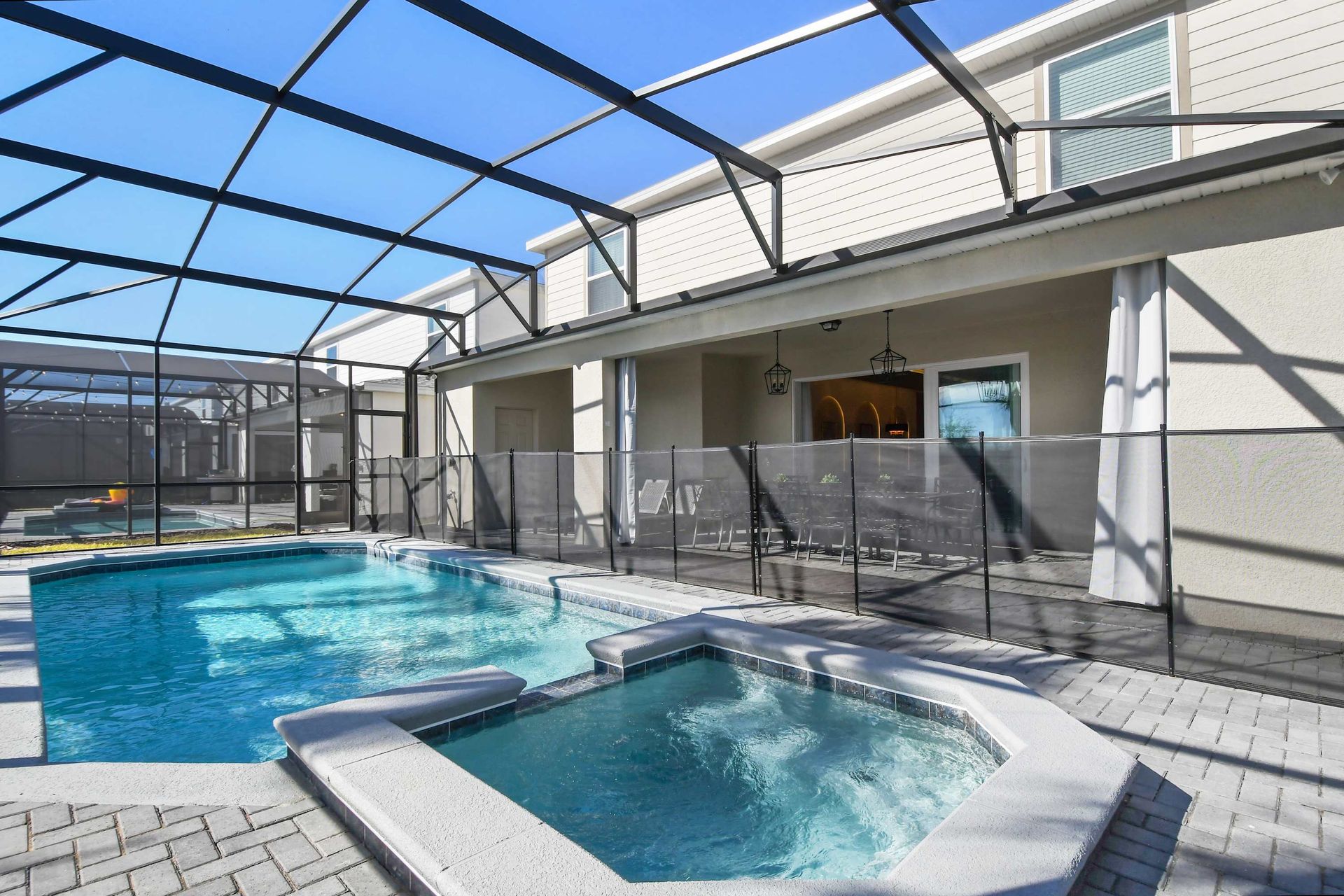 Private screened pool with spa, perfect for relaxing under the sun!