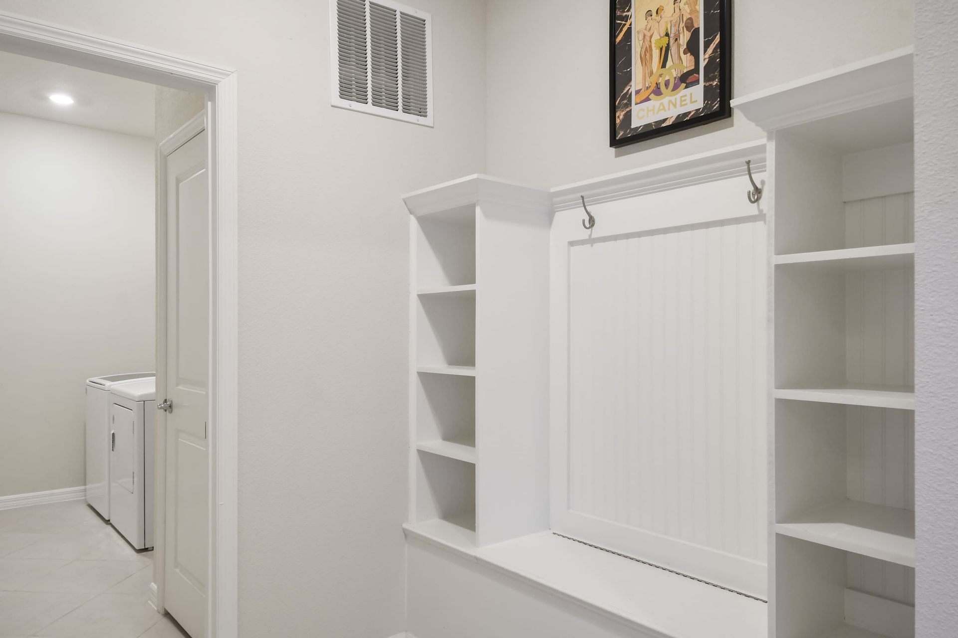 A functional and tidy mudroom with built-in storage and seating!