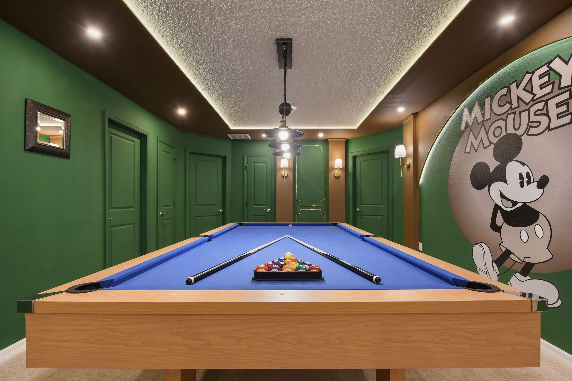 Playful Mickey Mouse-themed billiards room with a modern touch!