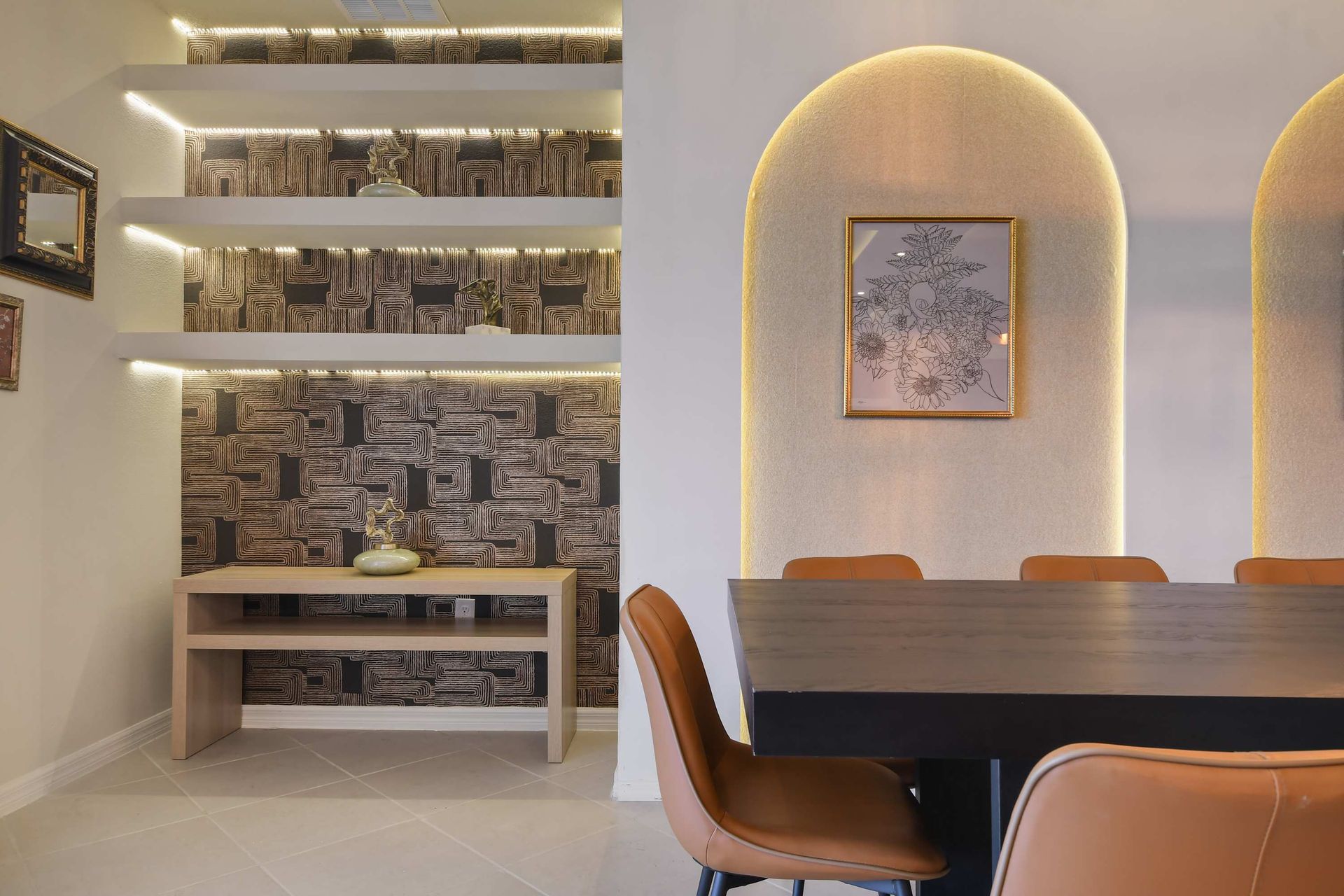 Modern accent wall with built-in shelves and warm lighting details!