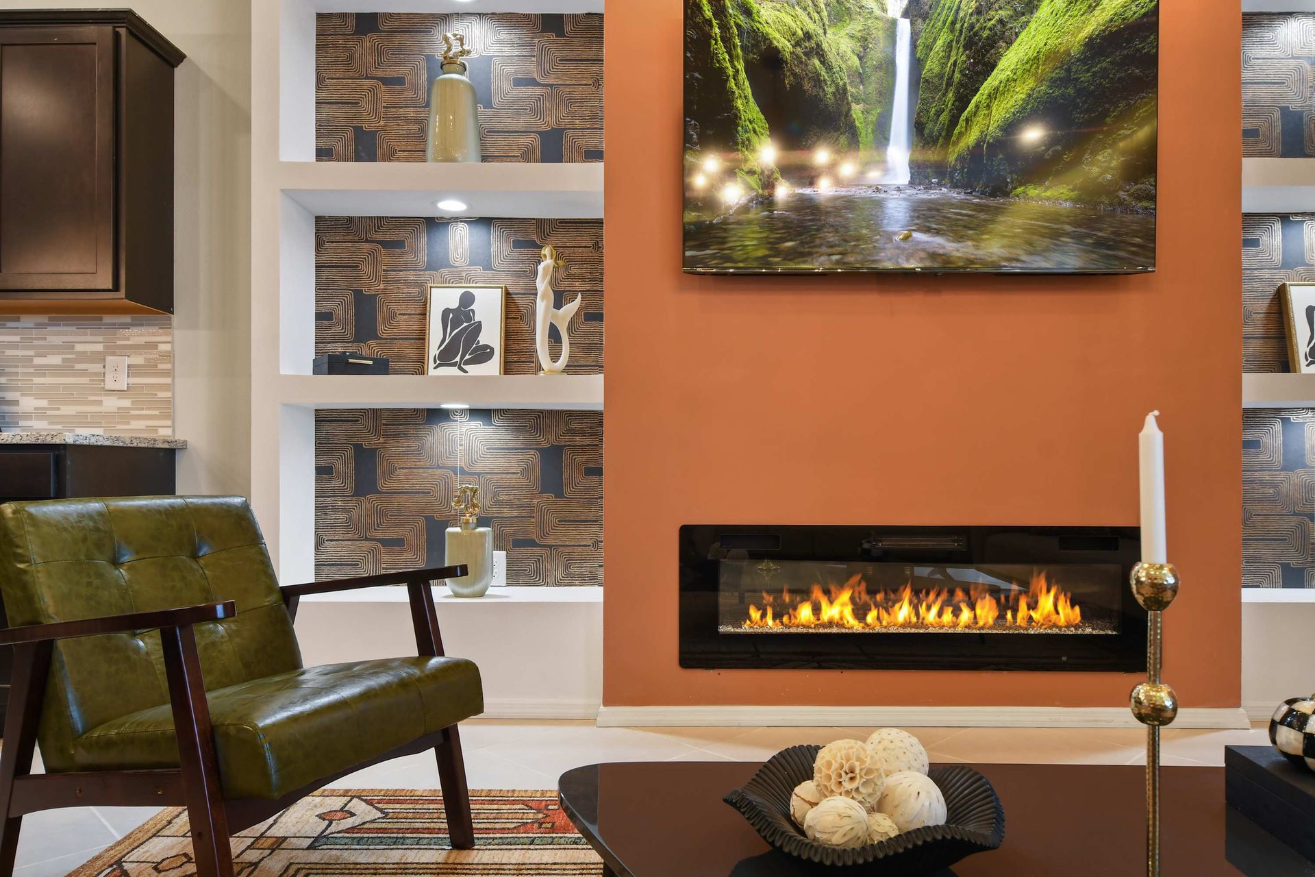 Stylish living room with a modern fireplace, warm tones, and art!