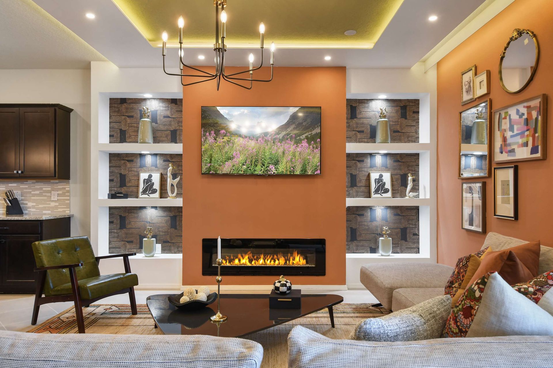 Cozy seating by a sleek fireplace with artistic decor accents!