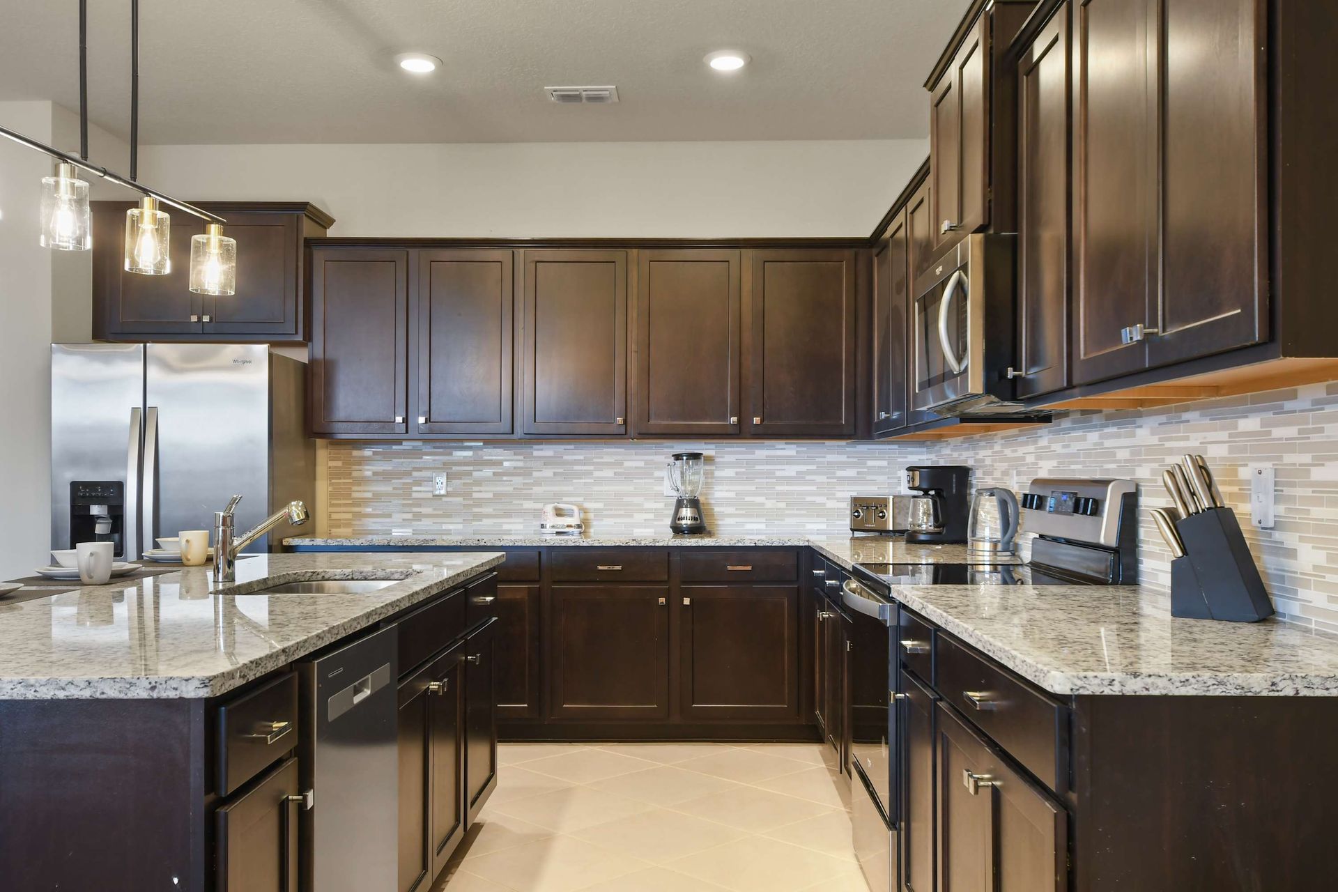 Spacious gourmet kitchen with granite island and modern appliances!