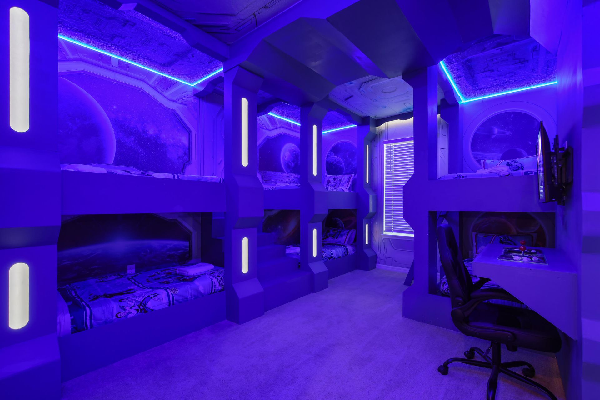 Epic space-themed bunk room with glowing lights and galactic vibes!