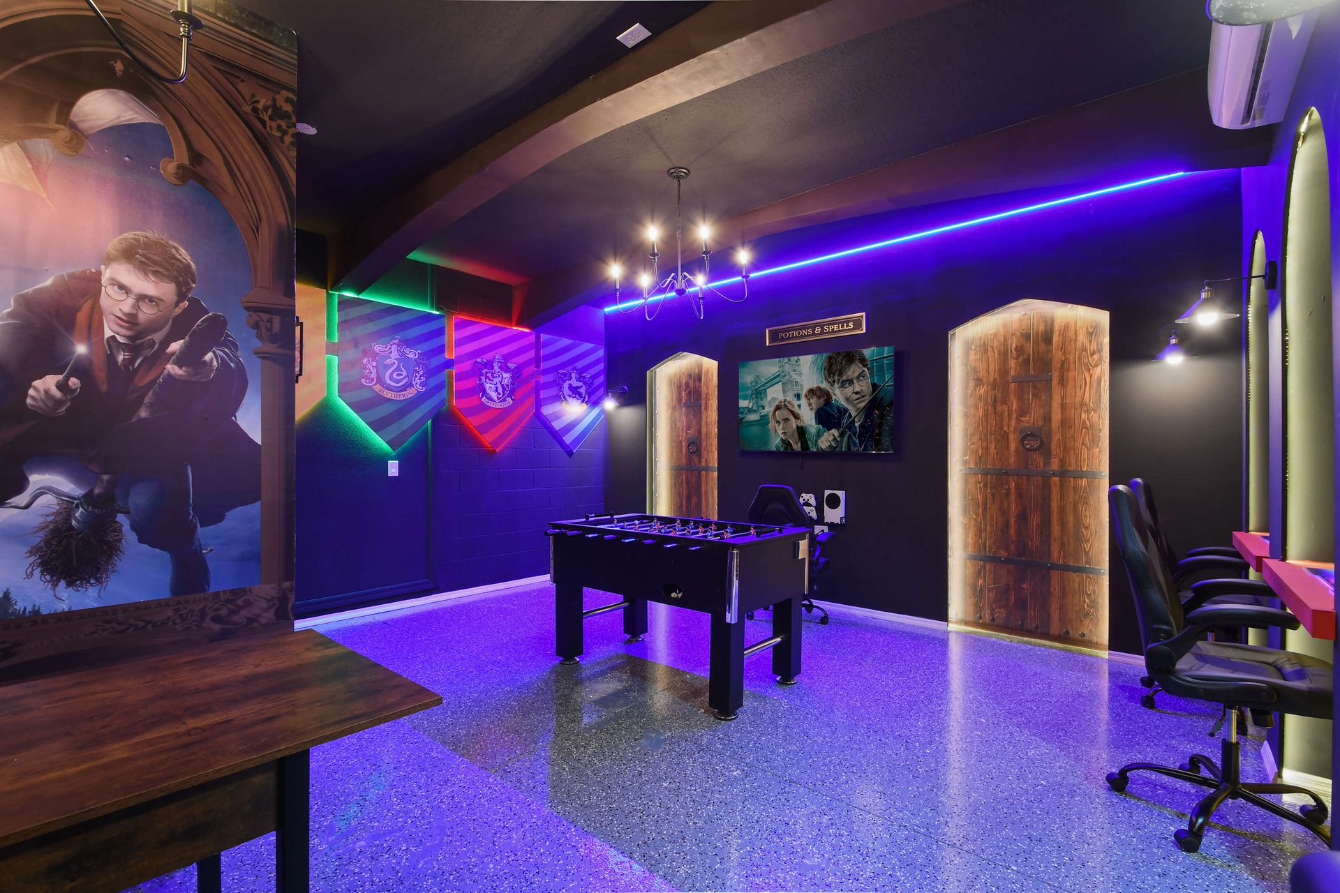 Magical Harry Potter-themed game room with house banners & foosball!