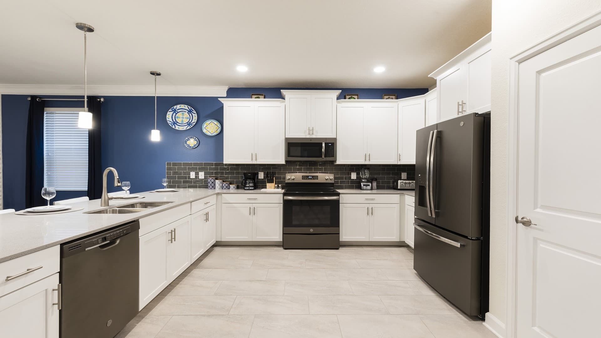 Spacious gourmet kitchen with modern appliances, sleek countertops, and style.