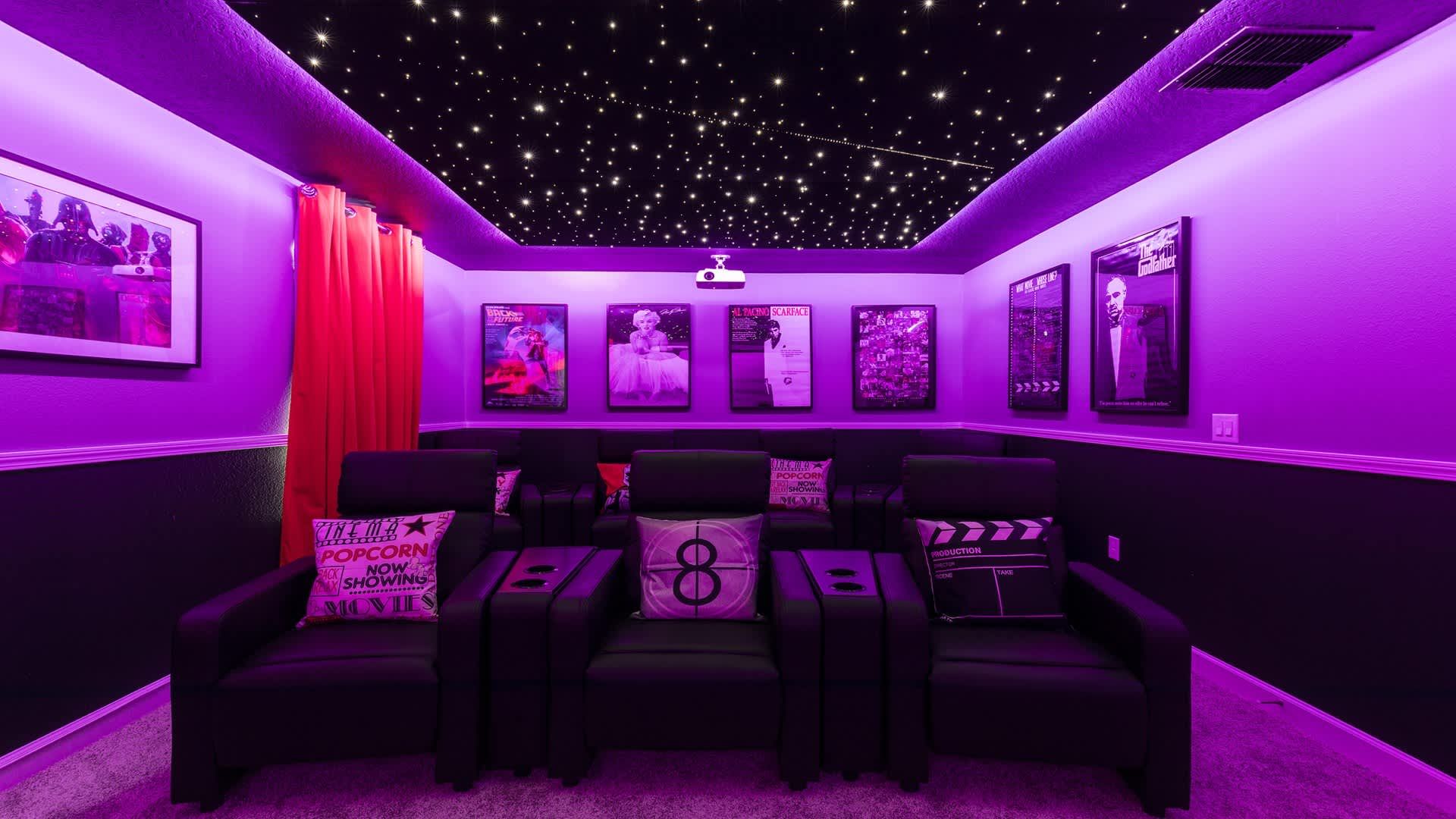 Private theater with star-lit ceiling, plush seating, and cinematic ambiance.