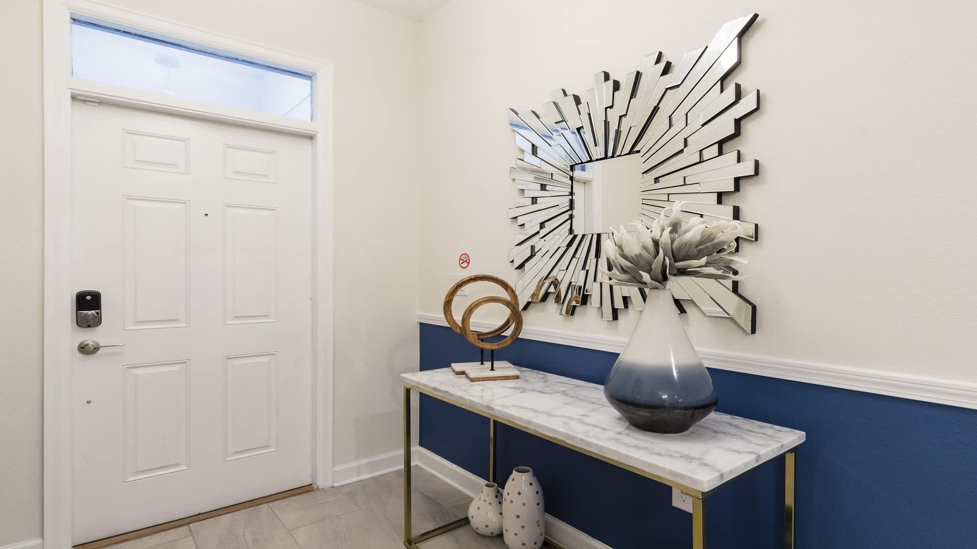 Stylish entryway with modern décor and elegant touches welcomes you inside.