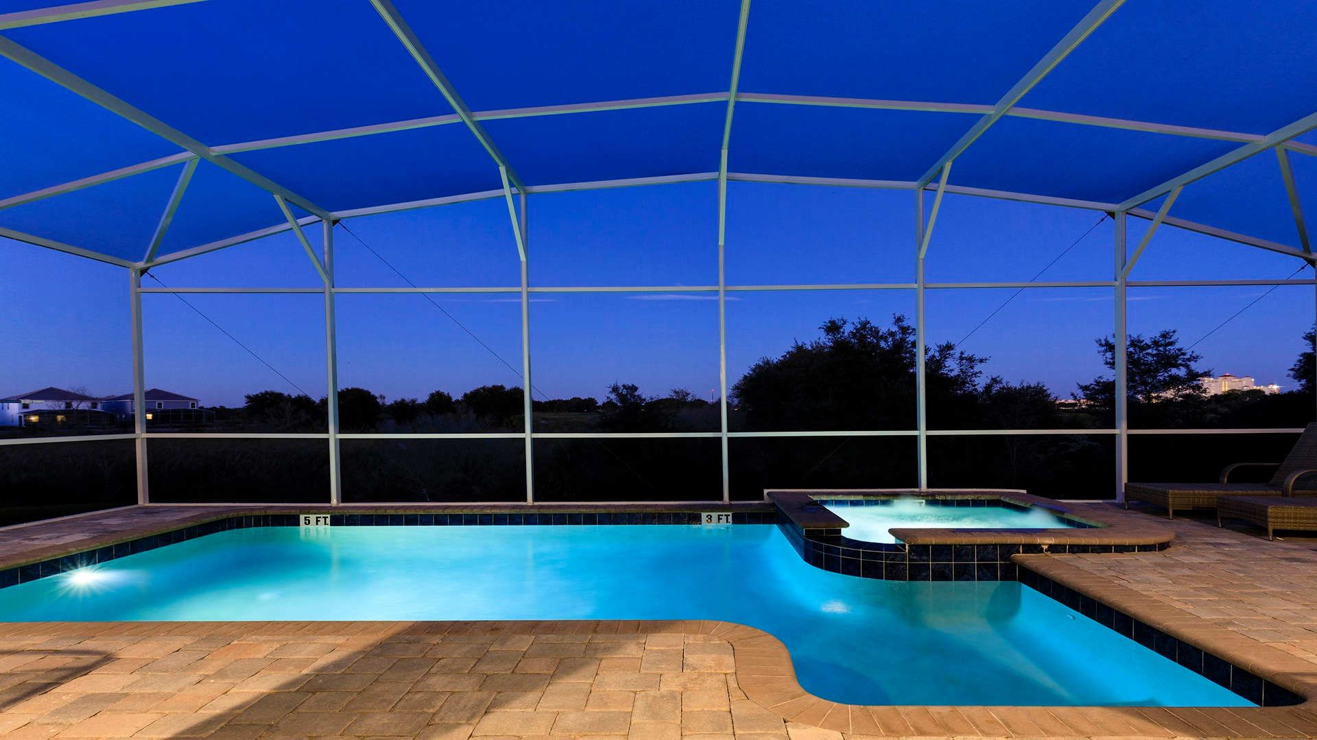Private screened pool and spa with serene evening views for ultimate relaxation.