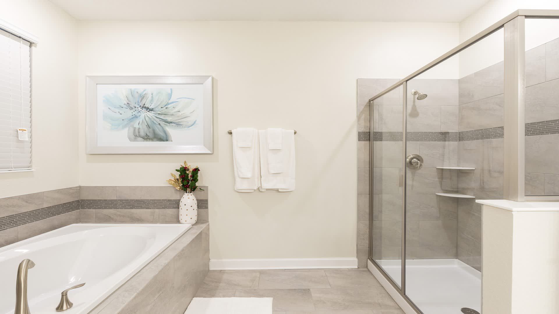 Spacious bathroom retreat with walk-in shower, soaking tub, and elegant décor.