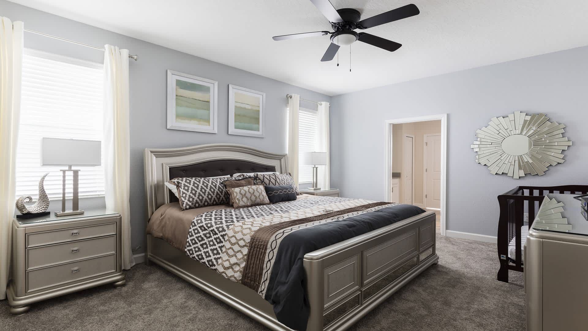 Elegant king bedroom with soft tones, stylish décor, and natural light.