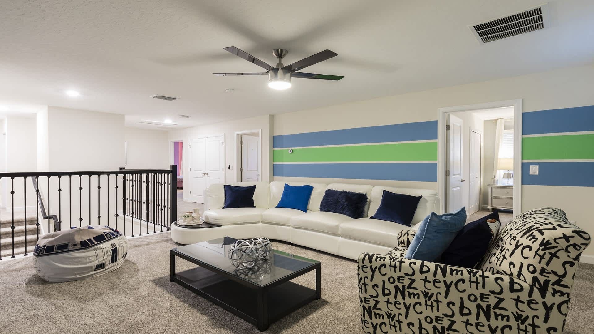 Spacious upstairs loft with vibrant decor and plenty of room for the whole family.