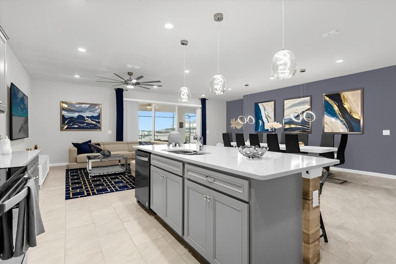 Bright open-concept kitchen, dining, and living area perfect for group gatherings.