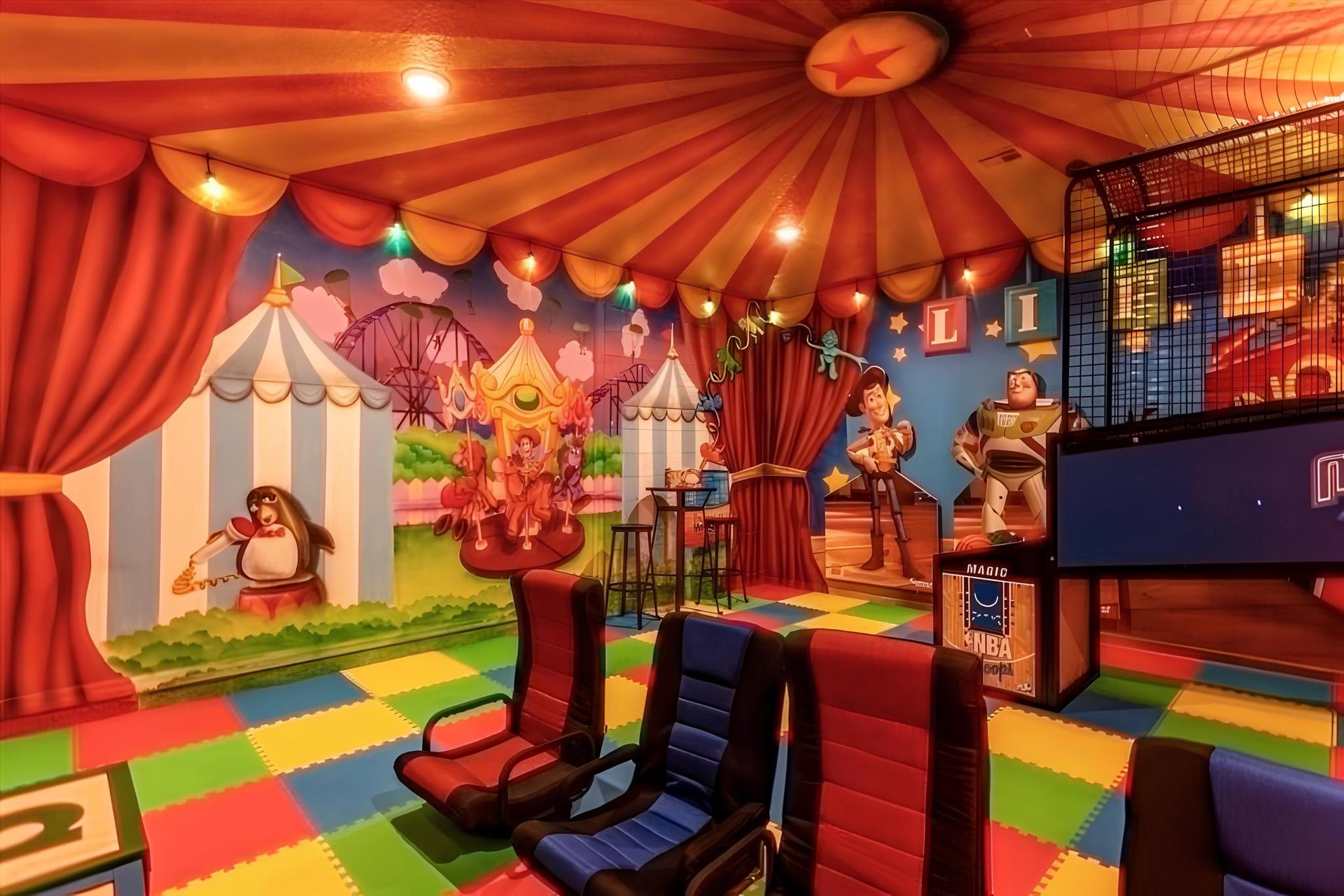 Colorful circus-themed playroom with arcade games, cozy seating, and vibrant murals.