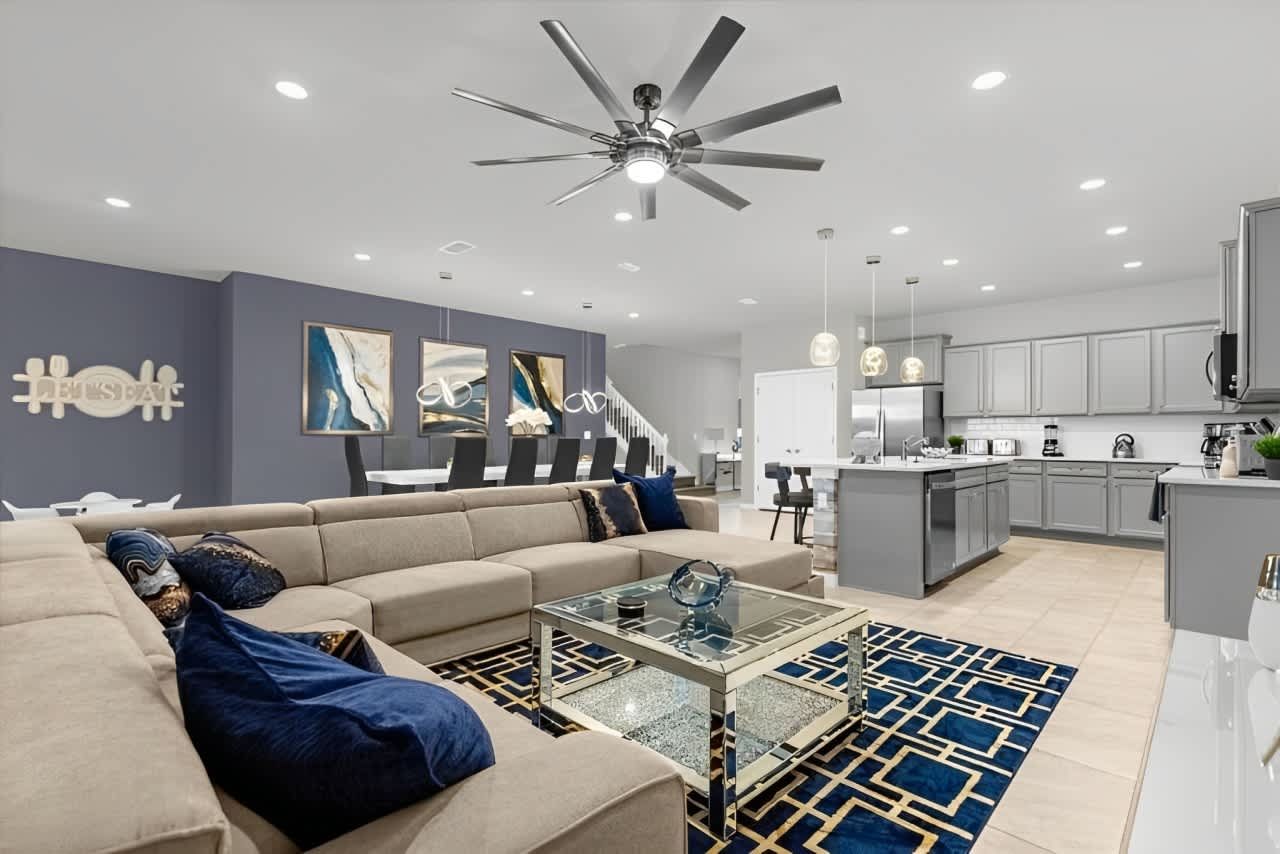 Open-concept living with sleek kitchen, spacious dining, and stylish modern décor.
