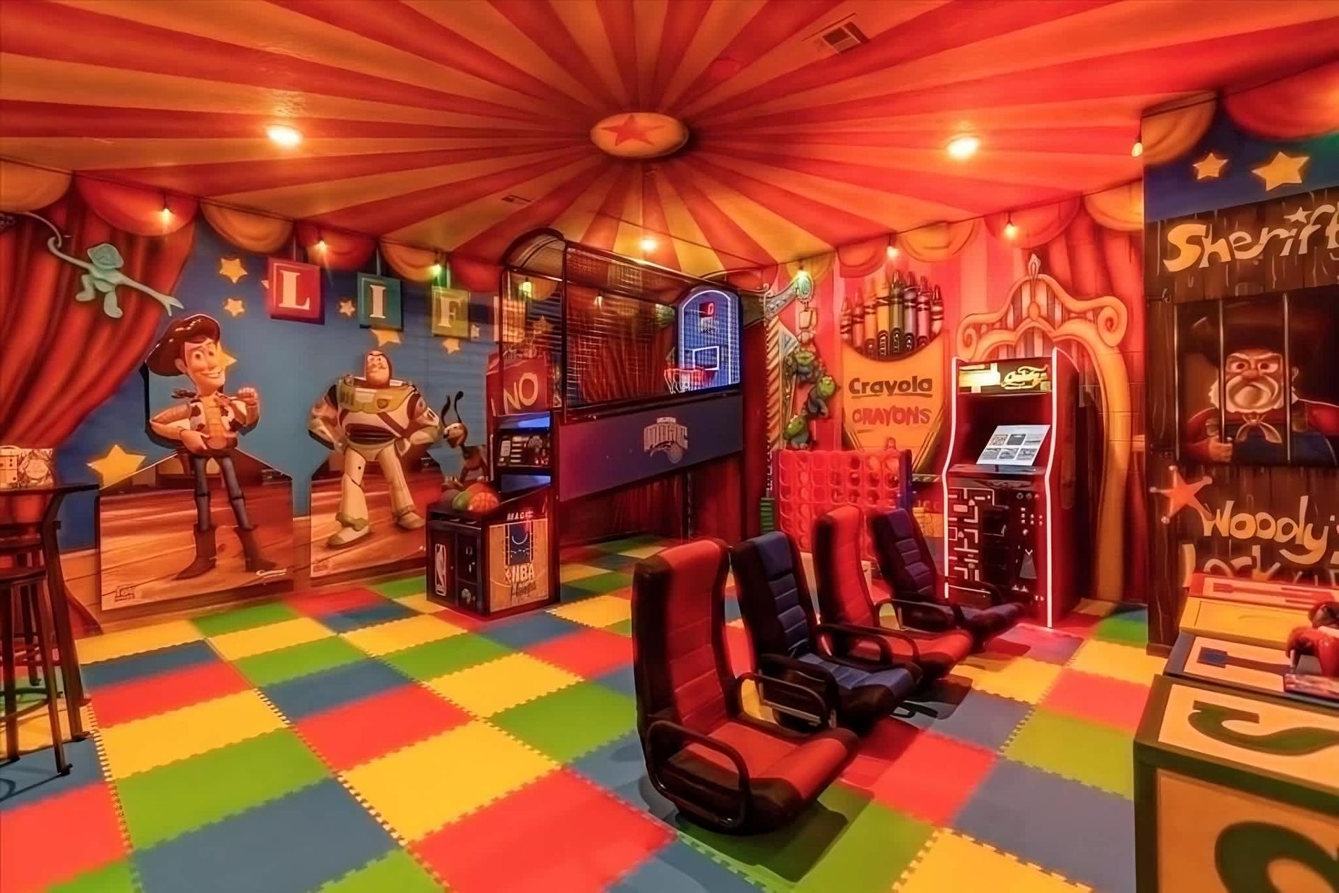 Action-packed Toy Story-themed game room with arcade, basketball, and movie chairs.
