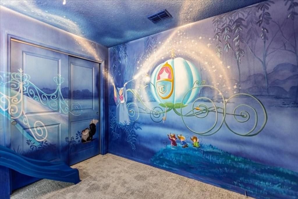 Enchanting fairytale room with magical carriage mural and dreamy princess-inspired design.